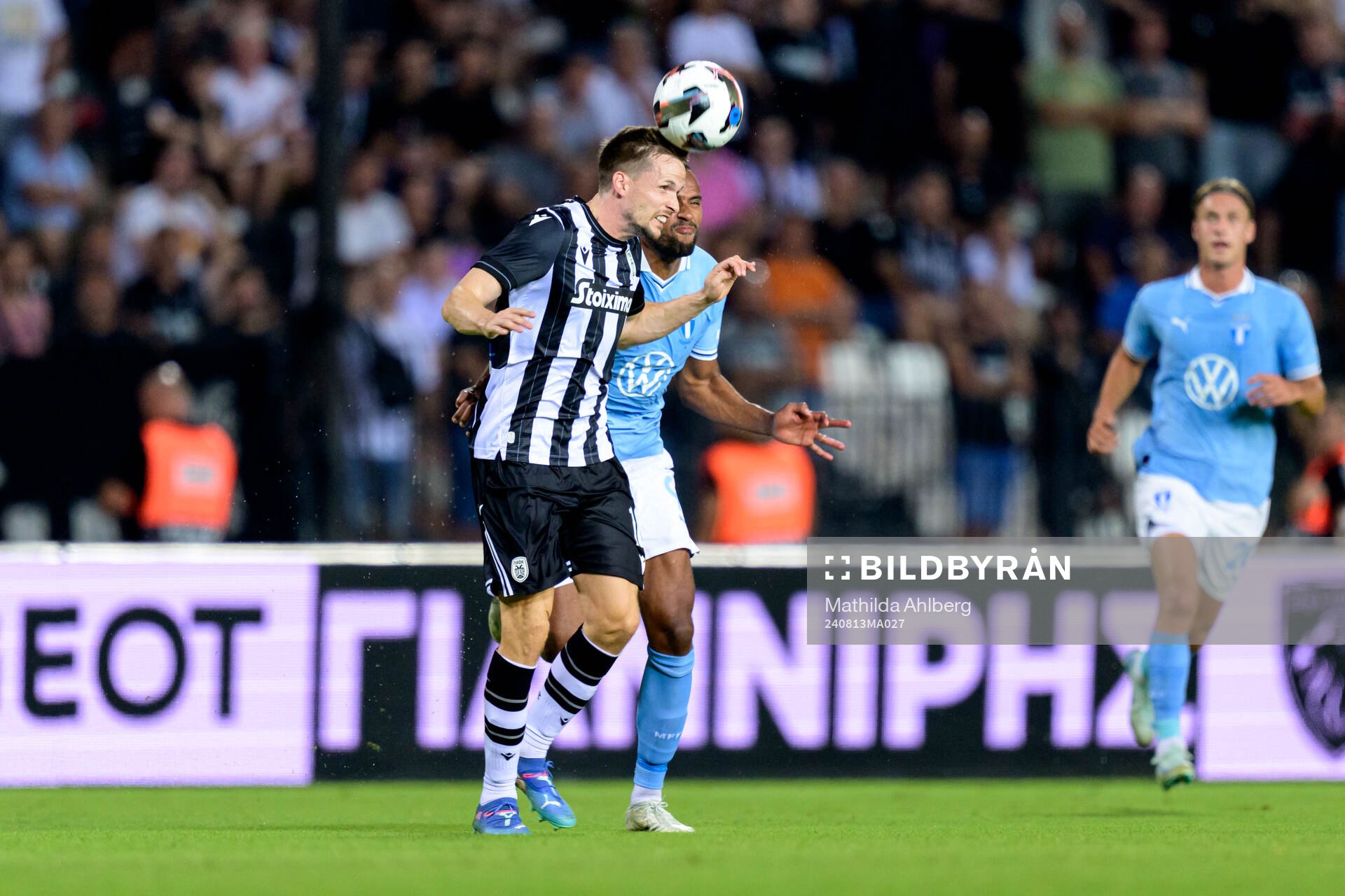 Tomasz Kedziora of PAOK and Isaac Kiese Thelin of Malmö FF during the UEFA Champions League football match between PAOK and Malmö FF on August 13, 2024 in Thessaloniki.