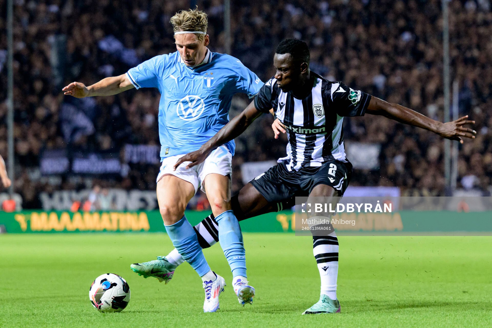 Jens Stryger Larsen of Malmö FF and Mady Camara of PAOK