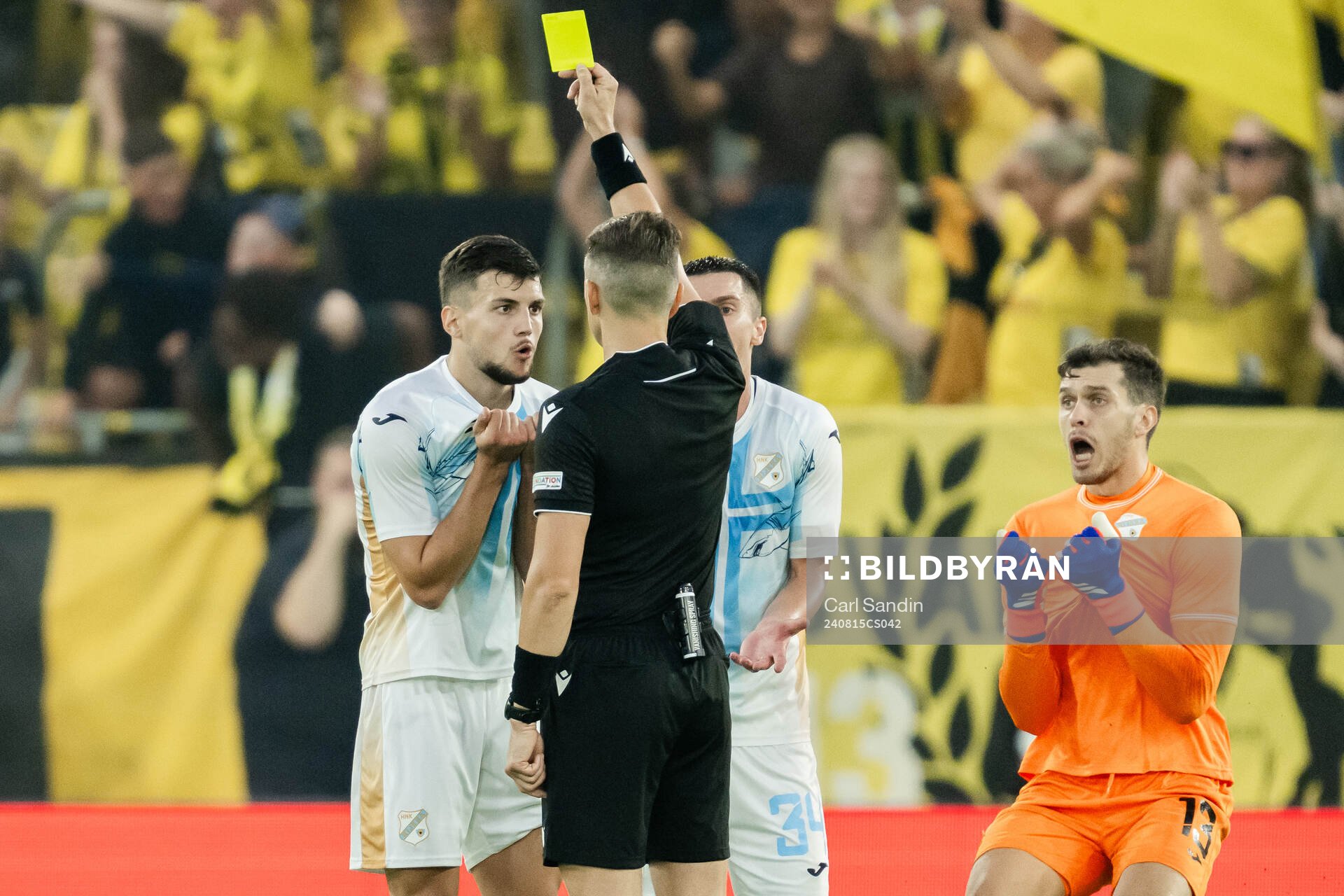 Niko Galesic of Rijeka receives a yellow card