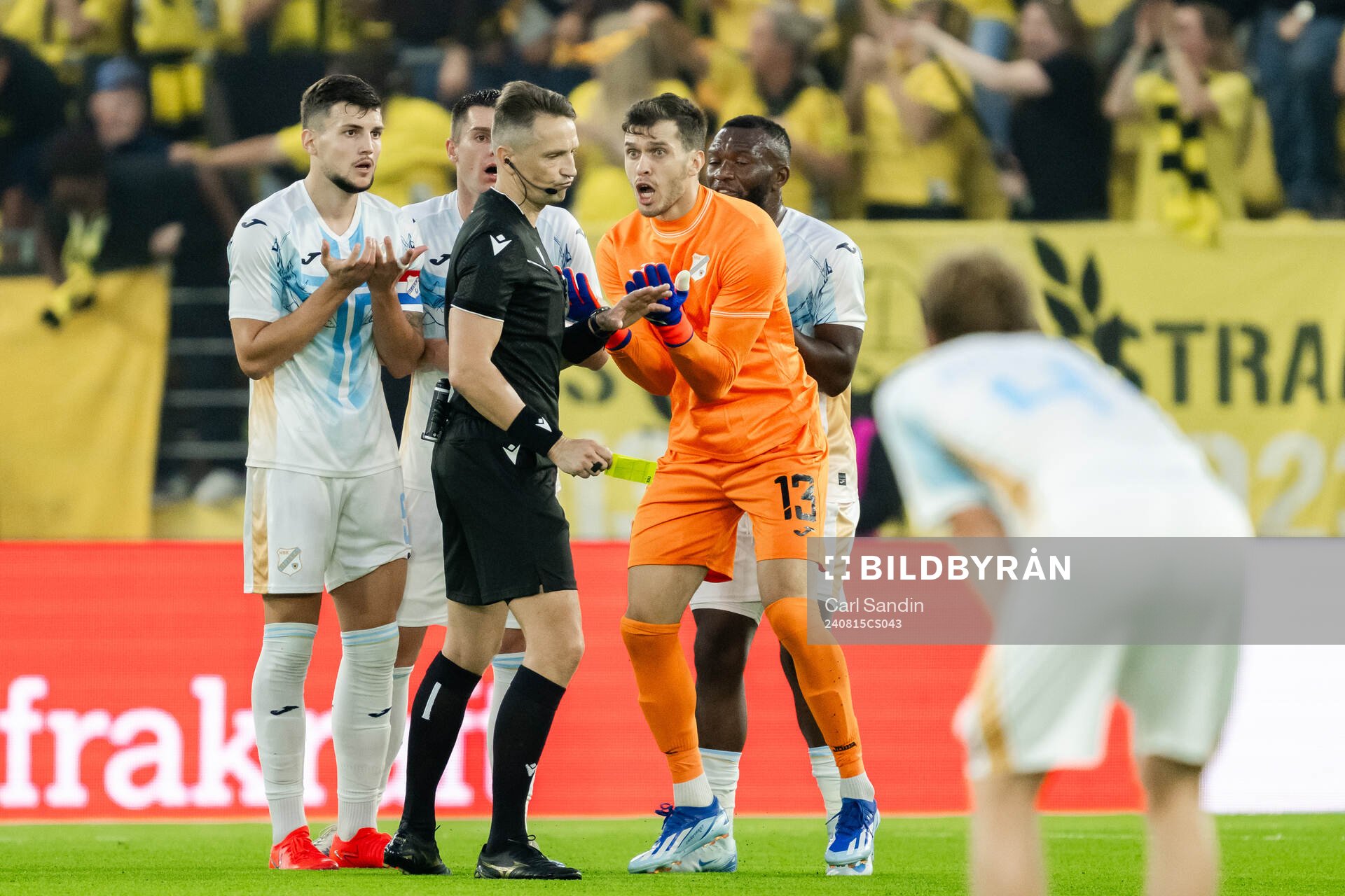 Niko Galesic and goalkeeper Martin Zlomislic of Rijeka