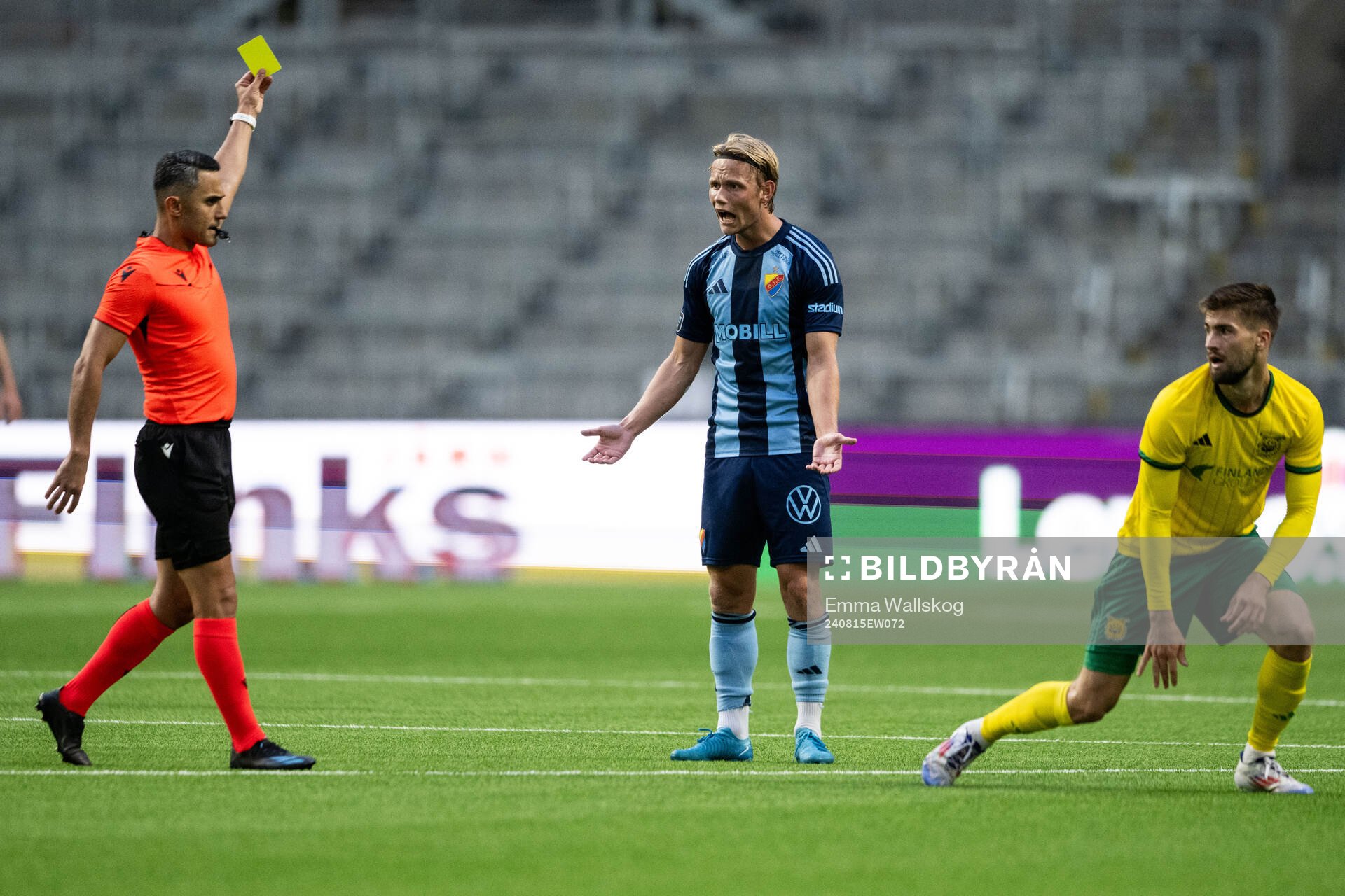 Tobias Gulliksen of Djurgården receives a yellow card from