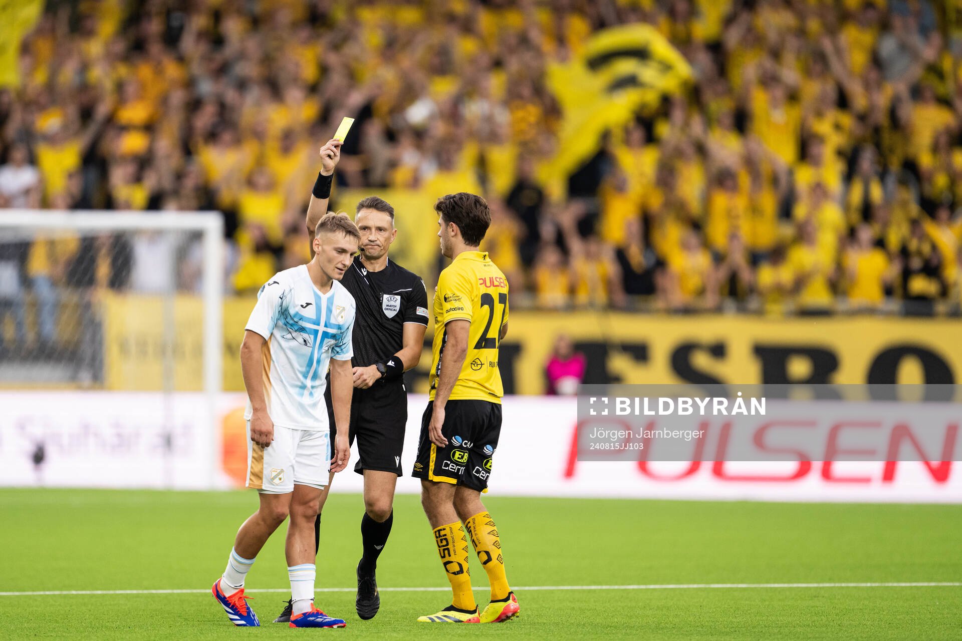 Toni Fruk of Rijeka is shown a yellow card by referee