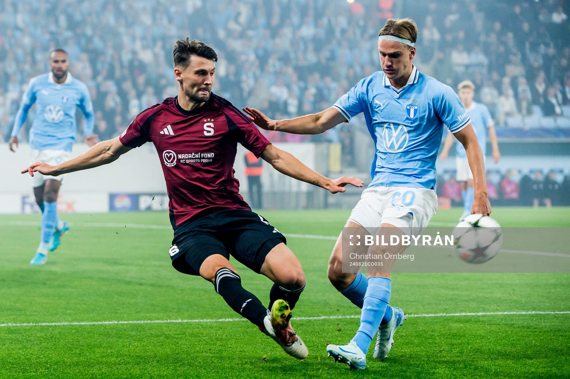 Kaan Kairinen of Sparta Prag and Erik Botheim of Malmö FF during the UEFA Champions League football match between Malmö FF and Sparta Prag on August 21, 2024 in Malmö.