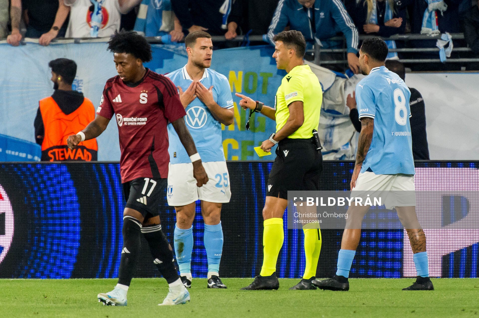 Gabriel Busanello of Malmö FF receives a yellow card from