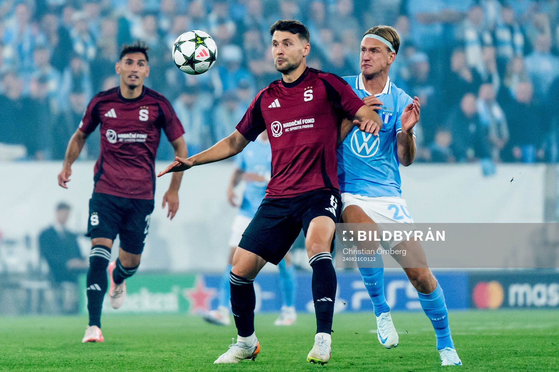 Kaan Kairinen of Sparta Prag and Erik Botheim of Malmö FF during the UEFA Champions League football match between Malmö FF and Sparta Prag on August 21, 2024 in Malmö.