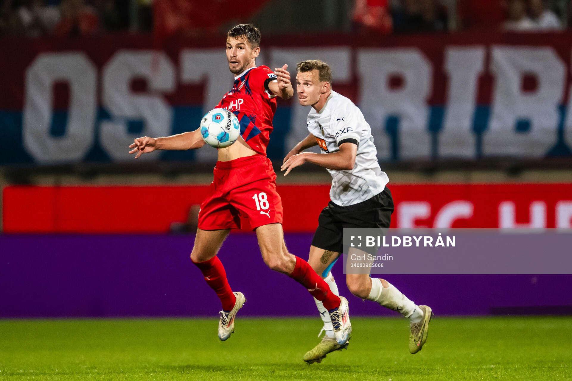 Marvin Pieringer of Heidenheim and Marius Lode of Häcken during the UEFA Conference League play-off match between Heidenheim and Häcken on August 29, 2024 in Heidenheim.
