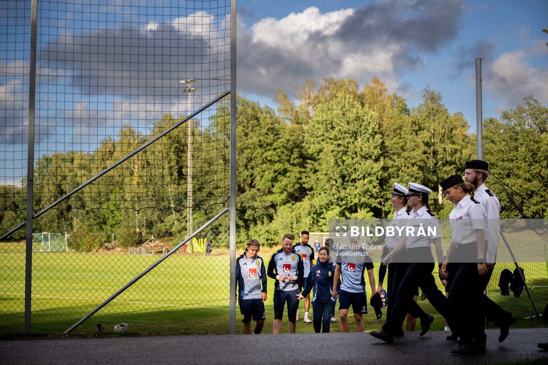Members of military in front of Sebastian Nanasi,