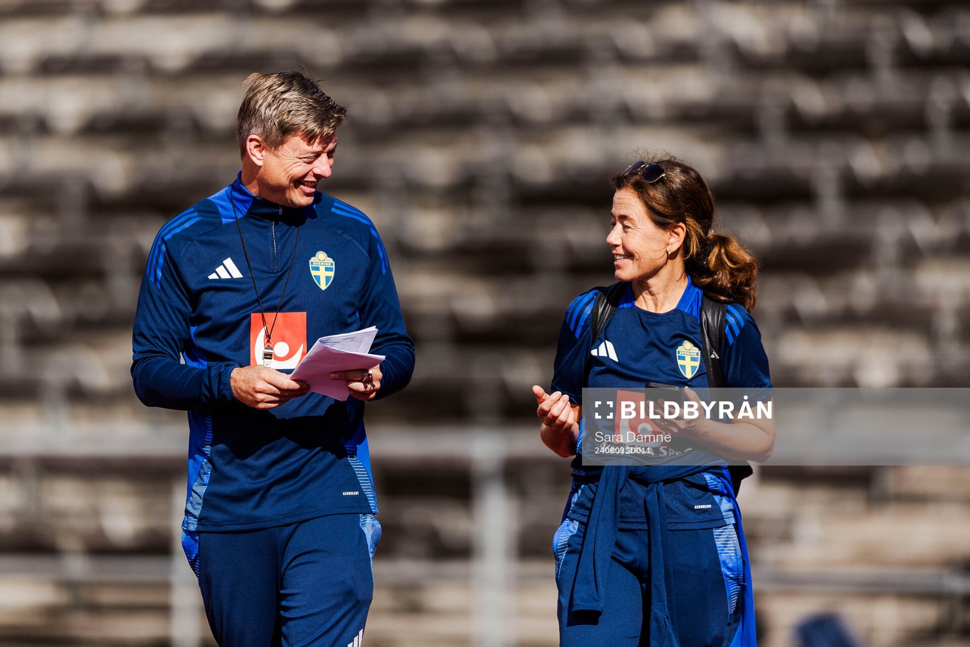 Head coach Jon Dahl Tomasson and media officer Petra