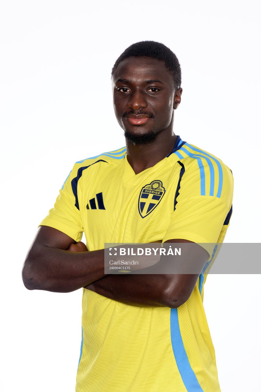 Imam Jagne poses for at portrait