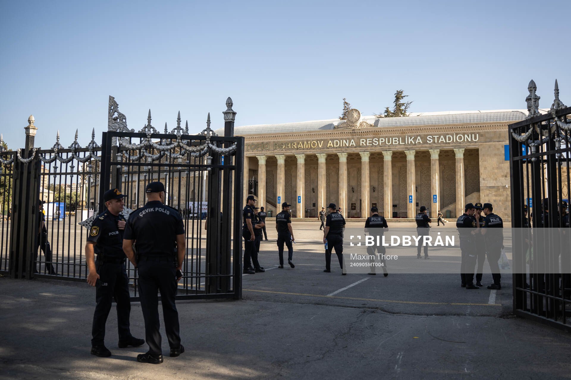 A police officer pass by outside of Tofiq Bahramov