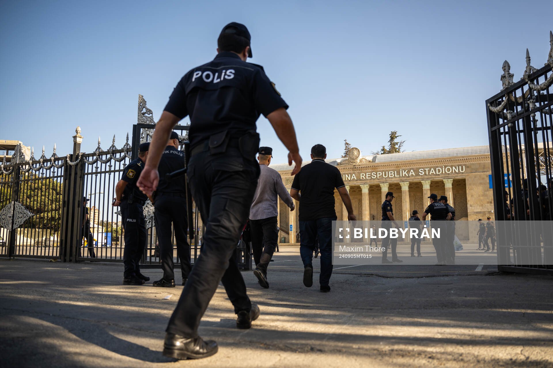 A police officer pass by outside of Tofiq Bahramov