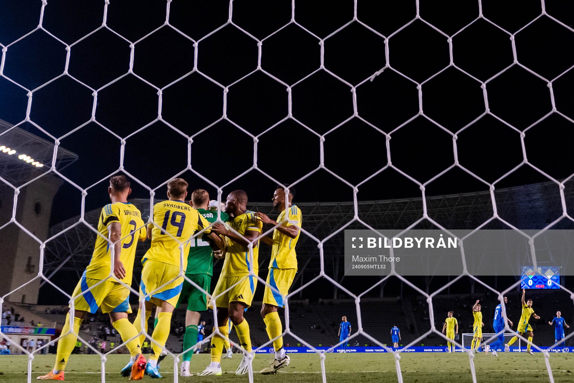 Players of Sweden celebrate with goalkeeper Viktor
