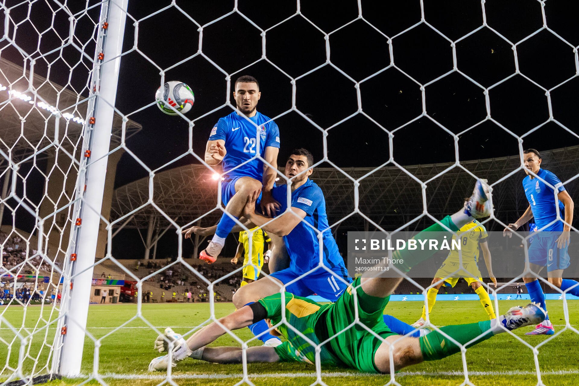 Aleksey Isaev and Emin Makhmudov of Azerbaijan against goalkeeper Viktor Johansson of Sweden during the Nations League football match between Azerbaijan and Sweden on September 5, 2024 in Baku.
