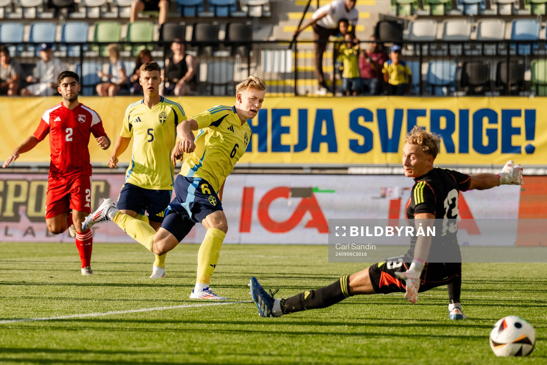 Daniel Svensson of Sweden scores the 1-0 goal behind