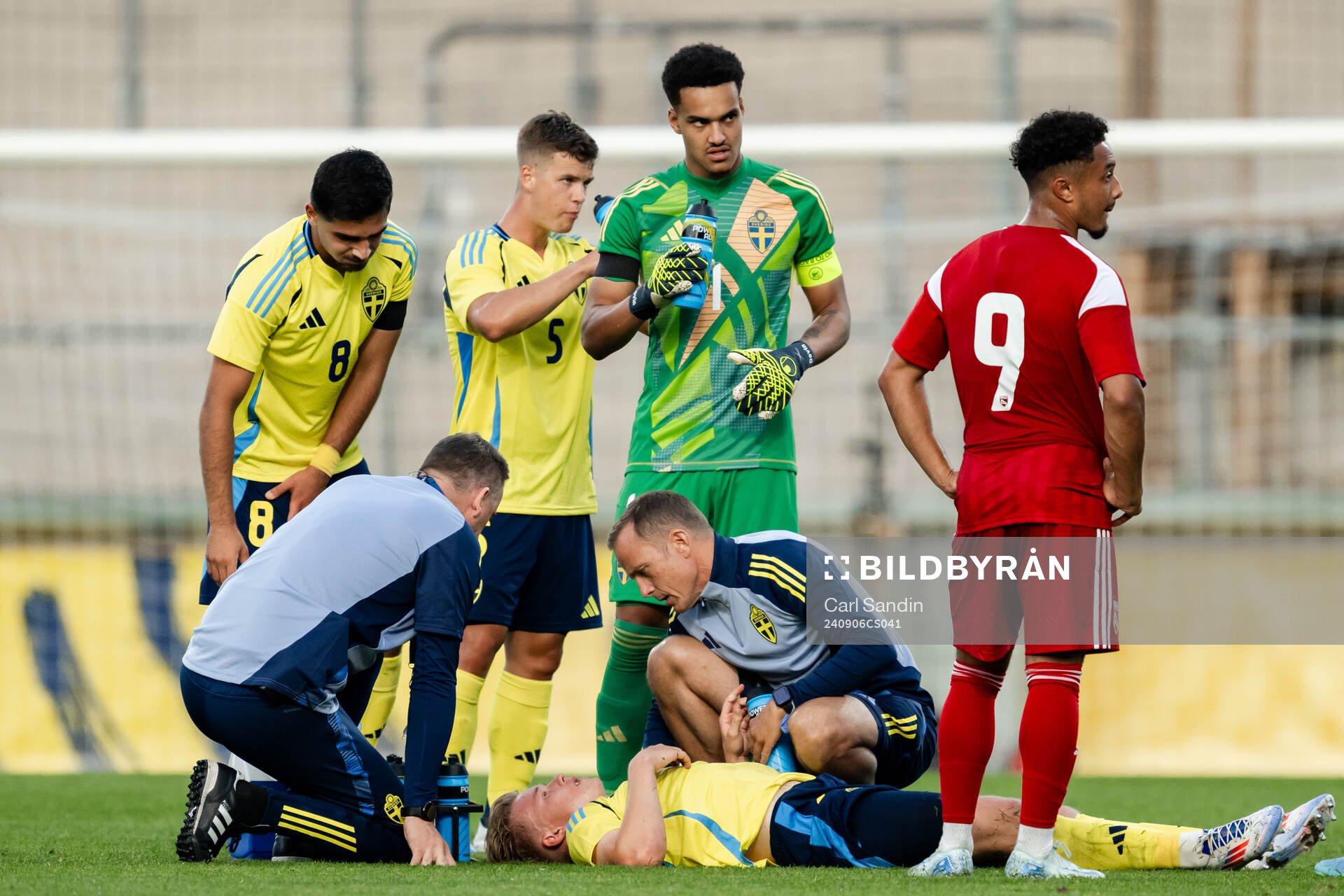 Daniel Svensson of Sweden receives medicinal attention