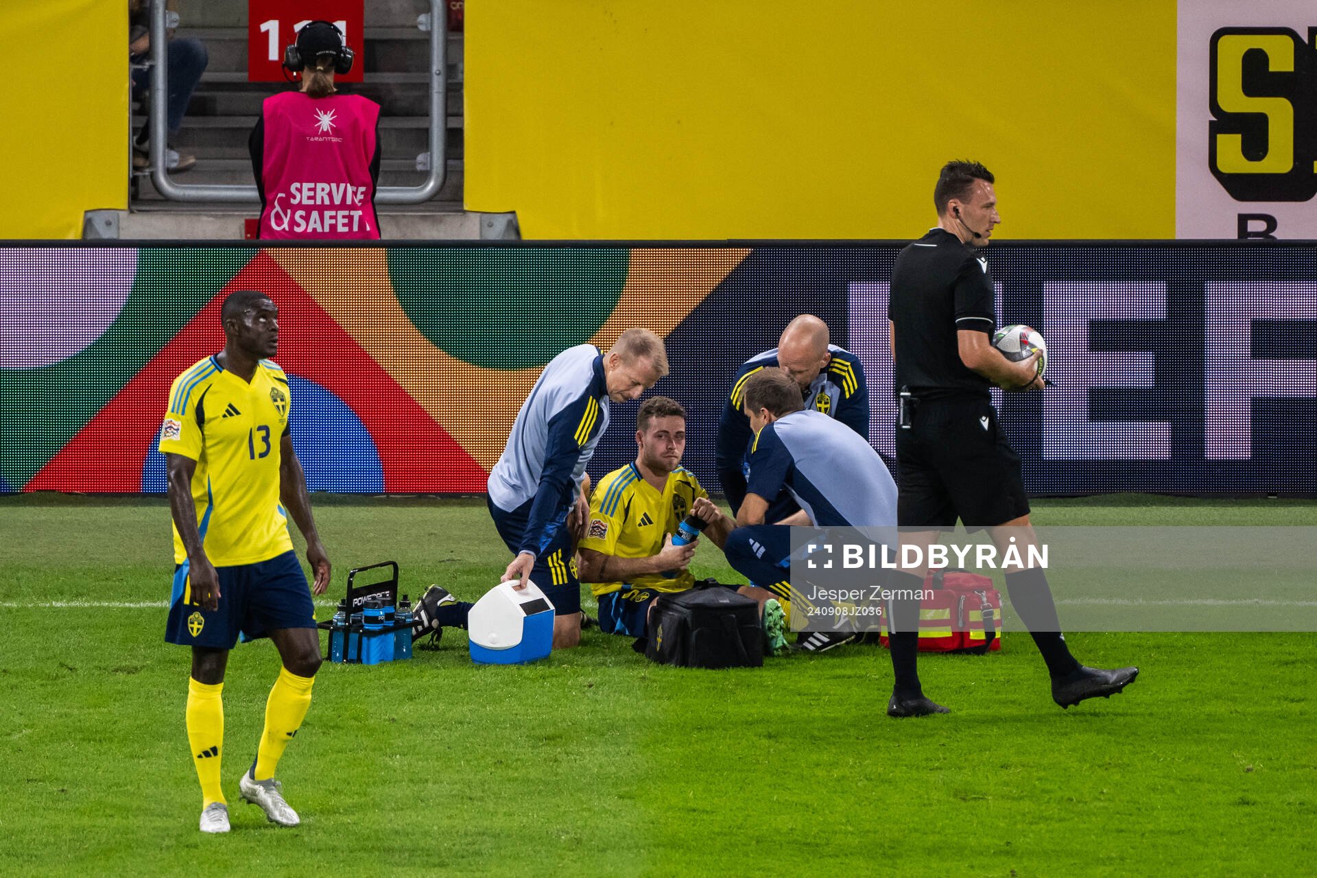 Gabriel Gudmundsson of Sweden receives medical attention