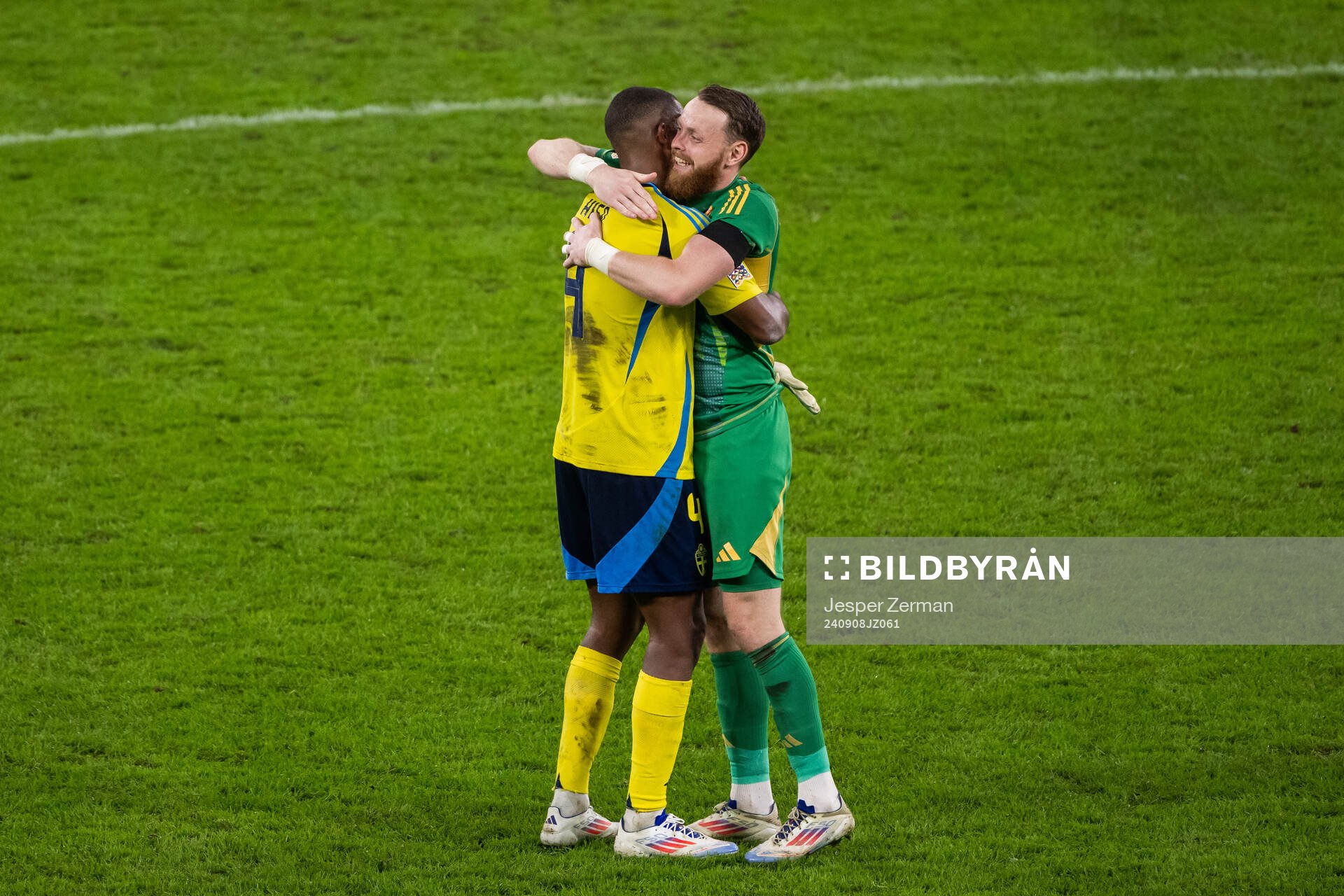Isak Hien and goalkeeper Viktor Johansson of Sweden