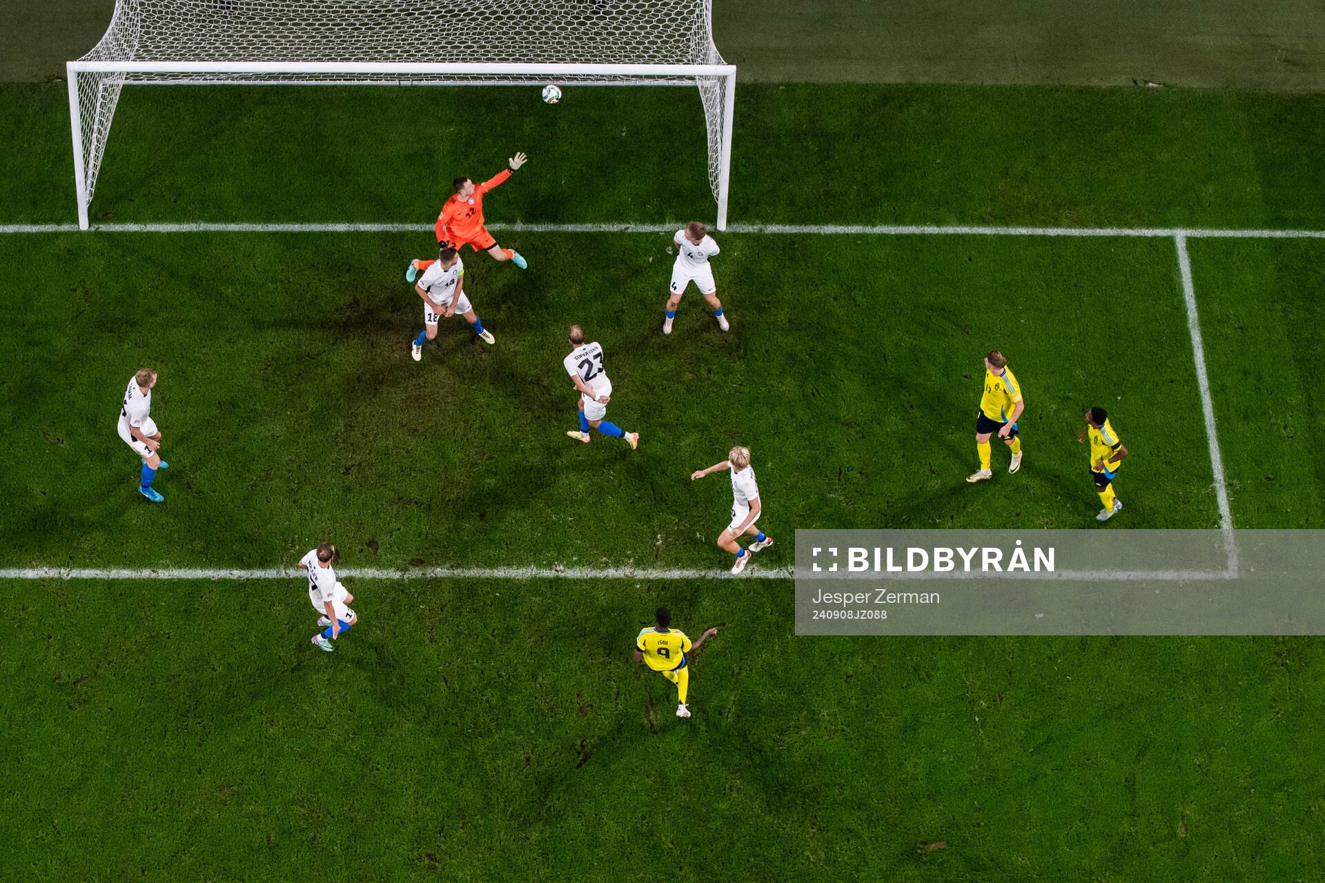 Alexander Isak of Sweden scores 2-0 behind goalkeeper Karl