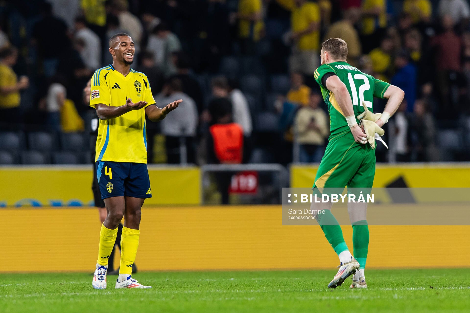Isak Hien and goalkeeper Viktor Johansson of Sweden