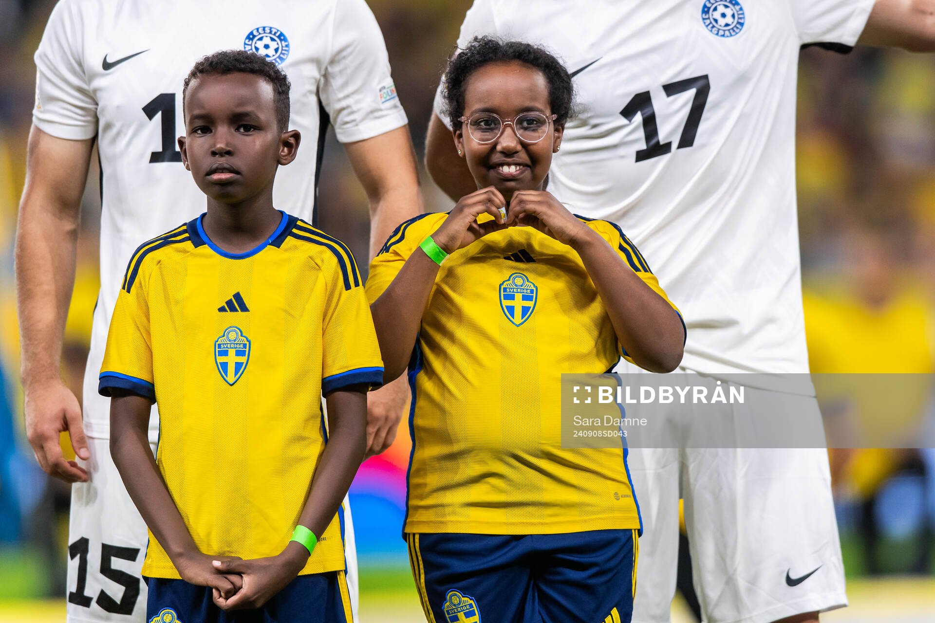 Mascots in front of players of Estonia