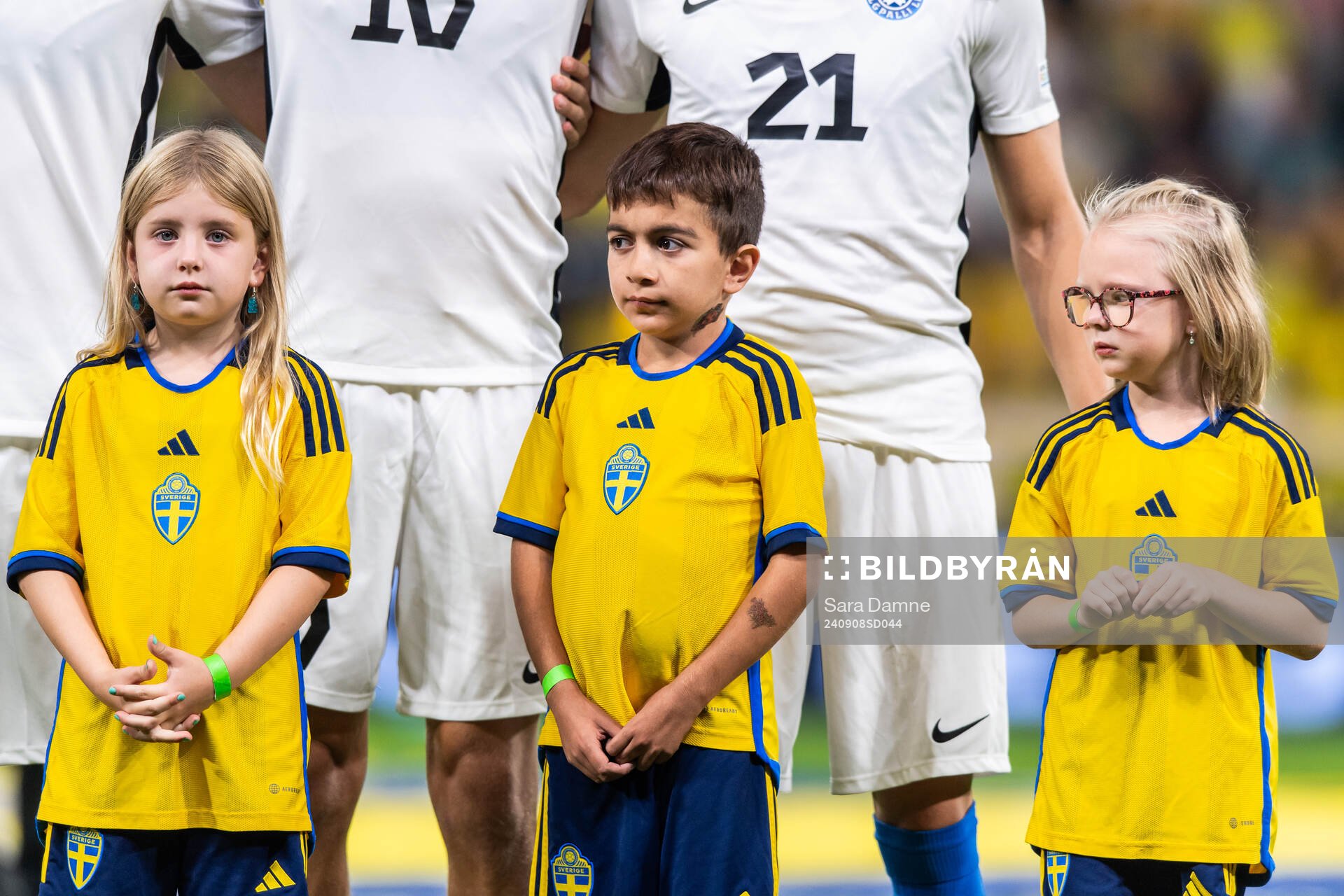 Mascots in front of players of Estonia