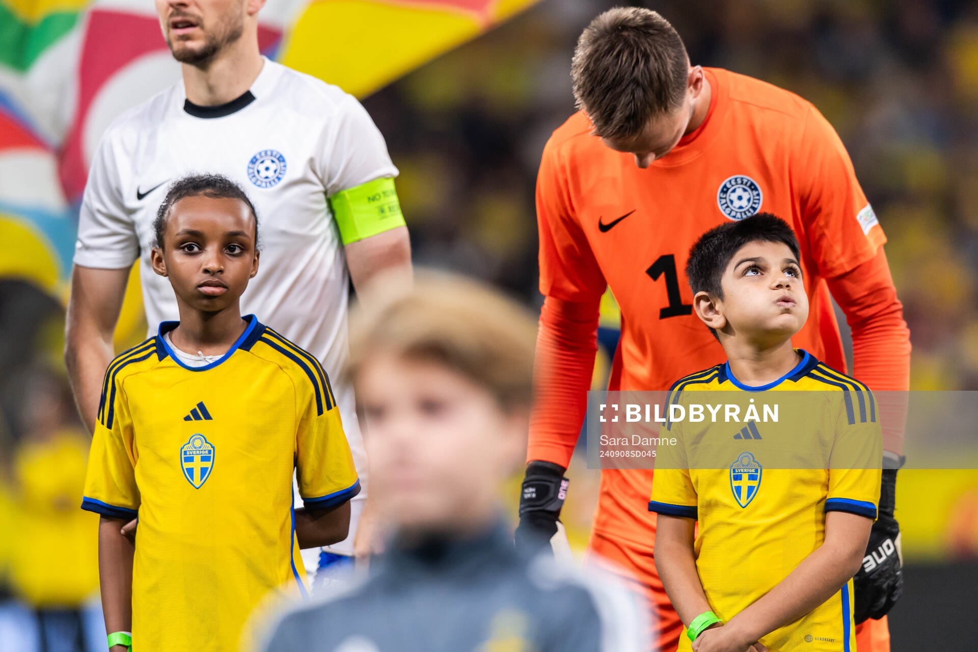 Mascots in front of players of Estonia