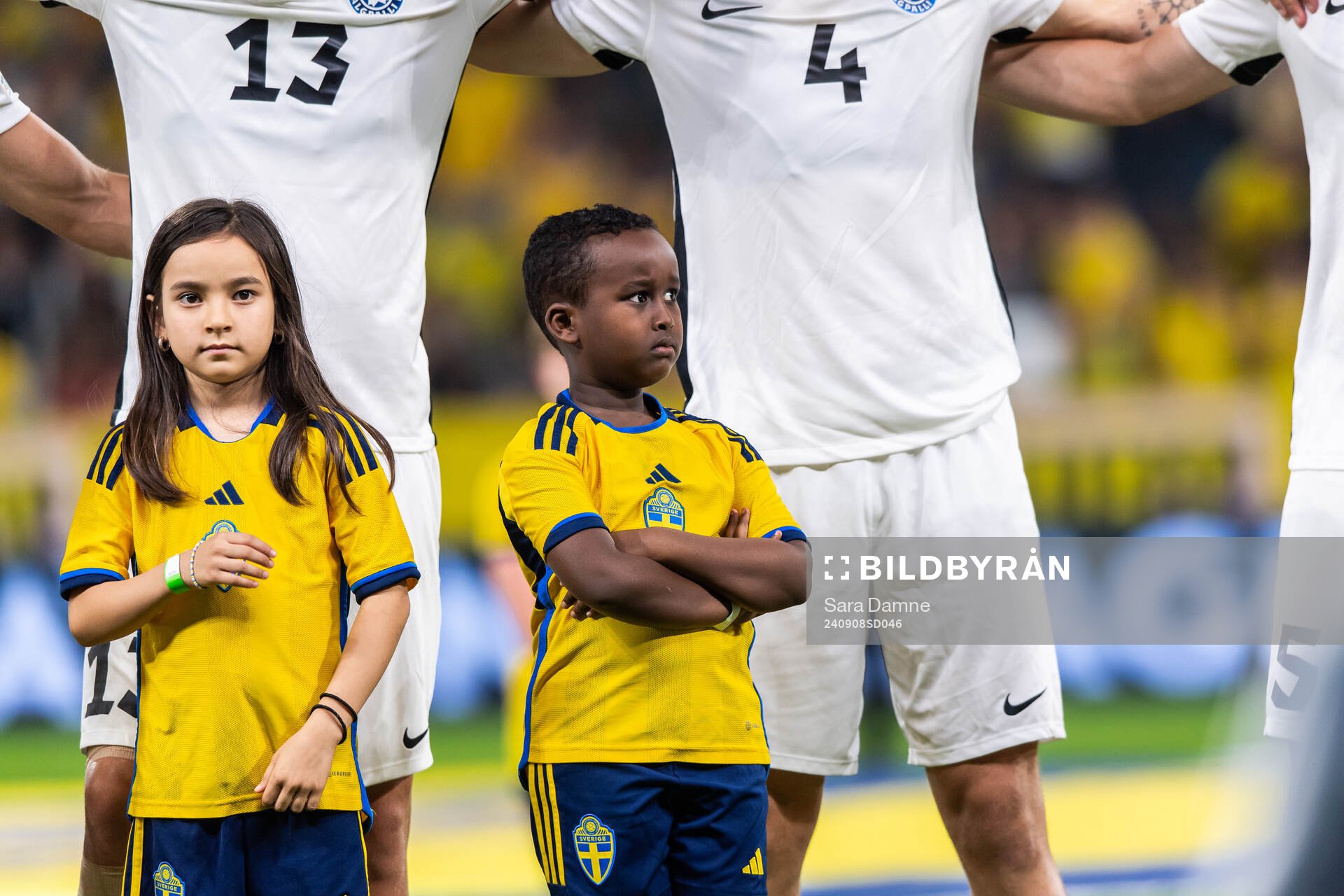 Mascots in front of players of Estonia