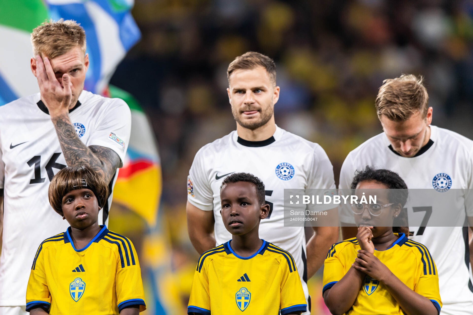 Mascots in front of players of Estonia