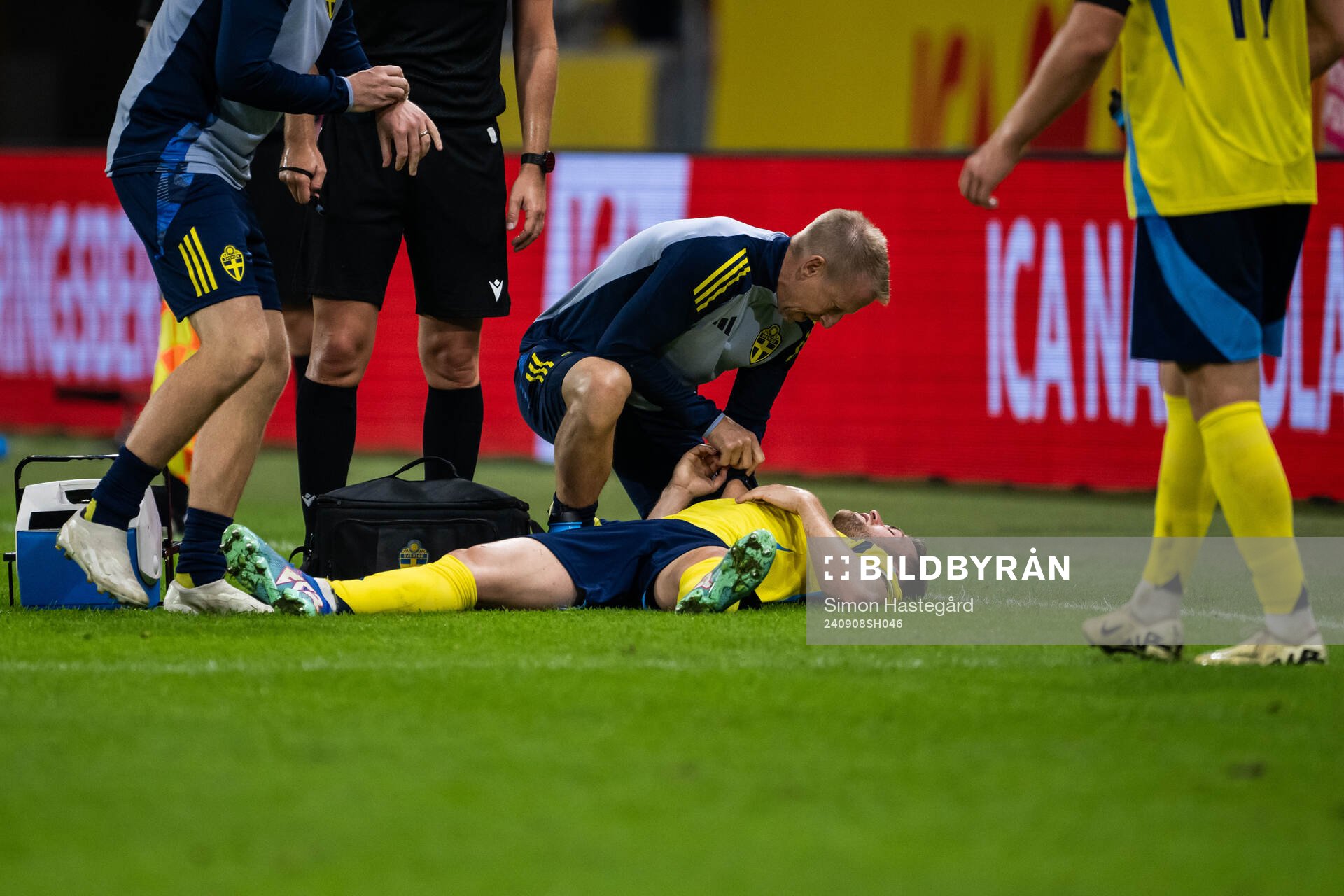 Gabriel Gudmundsson of Sweden receives medical attention