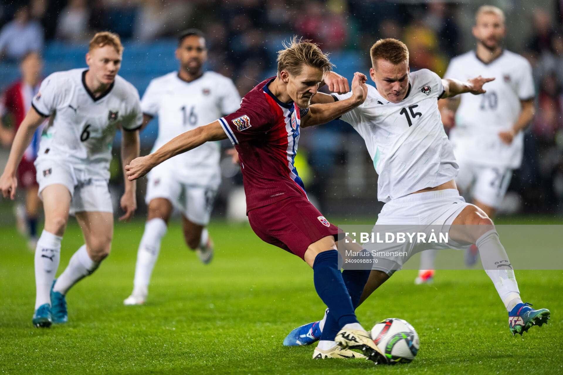 Martin Ødegaard of Norway and Philipp Lienhart of Austria
