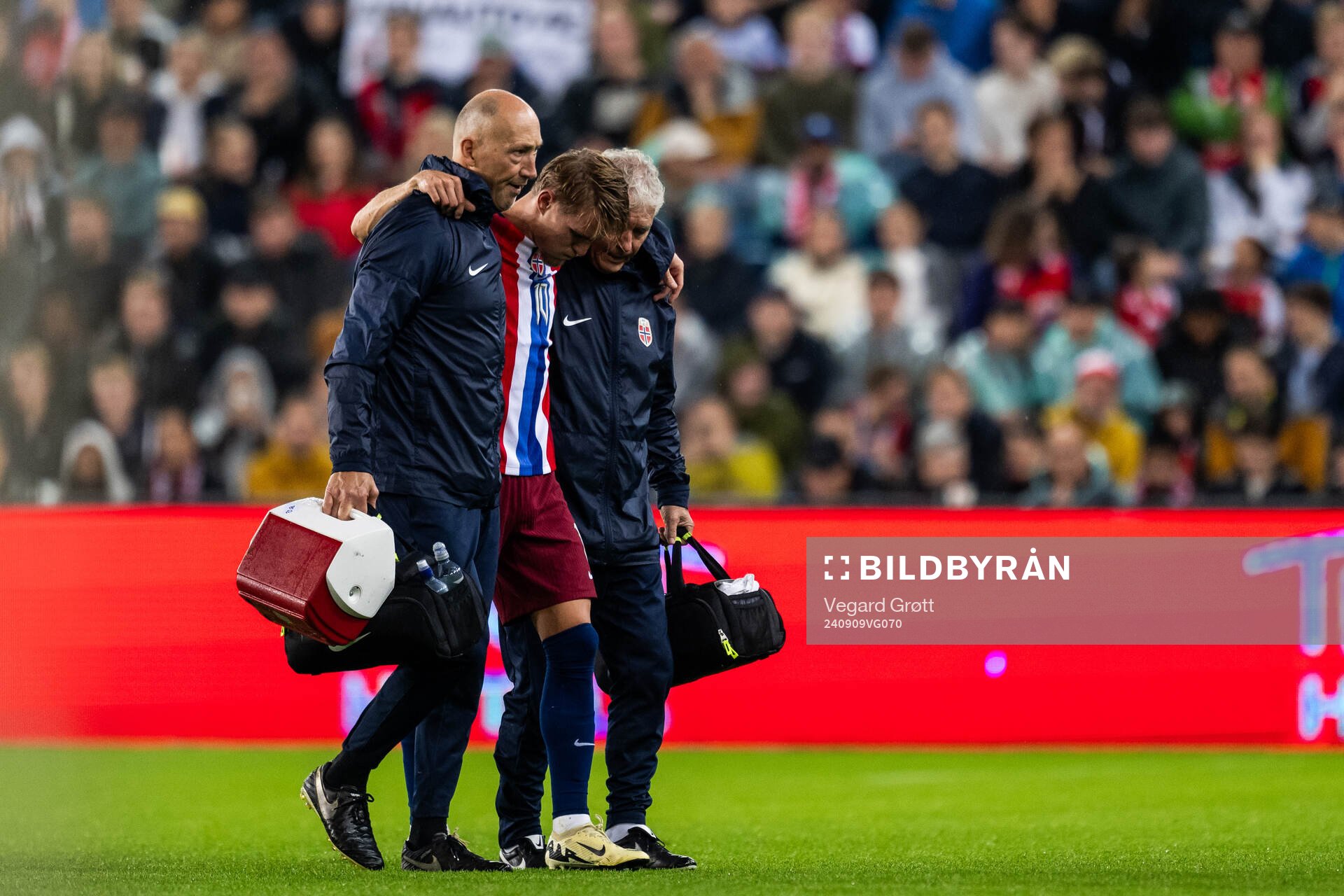 Martin Ødegaard of Norway leaves the pitch due to injury