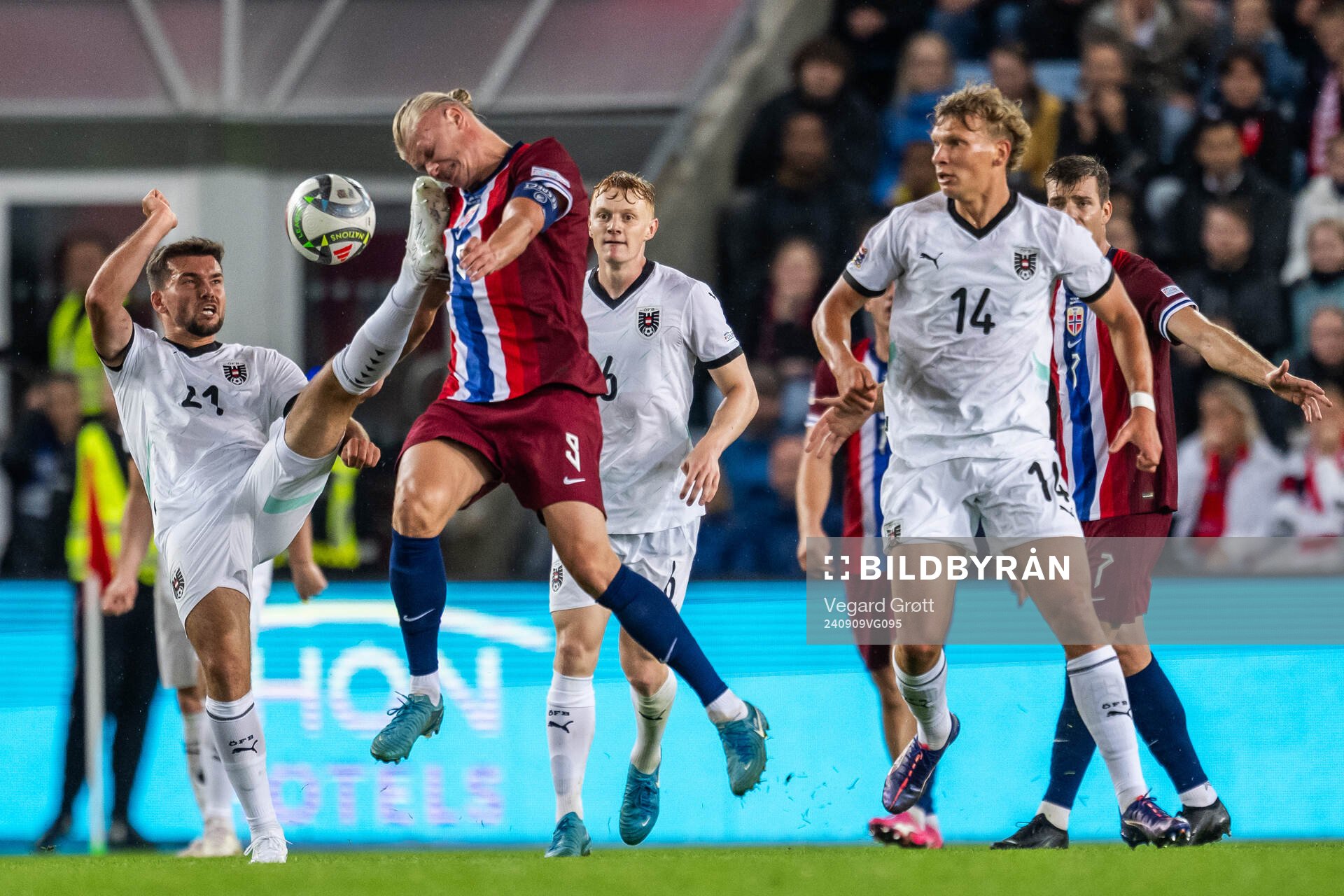 Kevin Stöger of Austria and Erling Braut Haaland of Norway