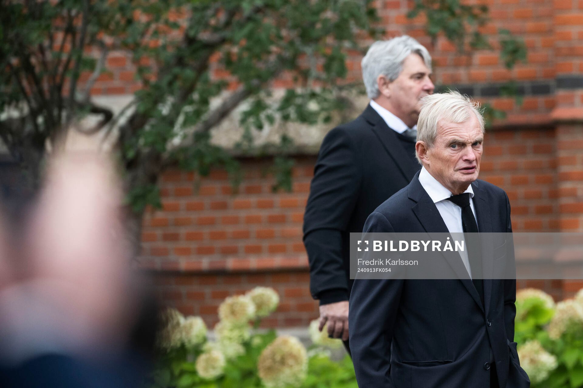 Thomas Wernerson (L), former football player and director,