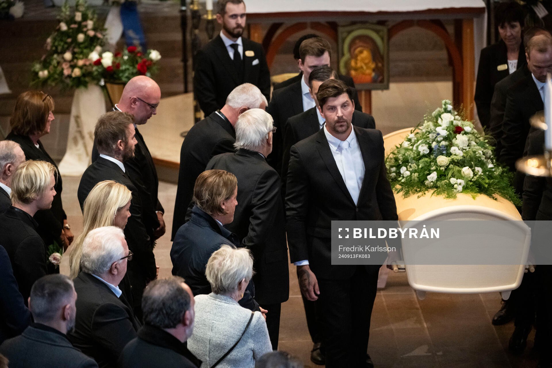 David Beckham watch the coffin being carried out
