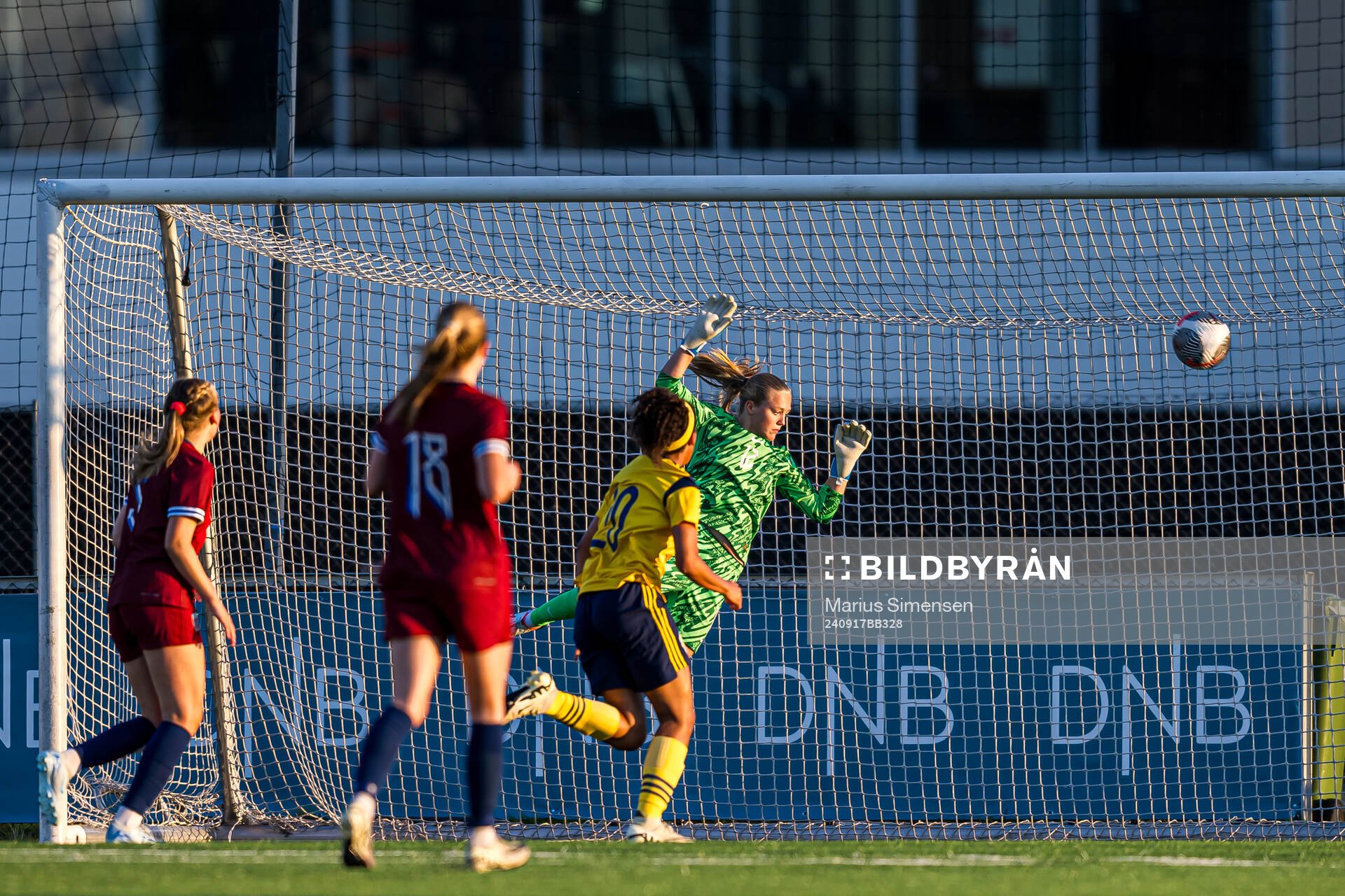 Cornelia Ljungberg of Sweden scores the 2-2 goal behind goalkeeper Helene Olsson of Norway during the under 15 friendly match between Norway and Sweden on September 17, 2024 in Jessheim.