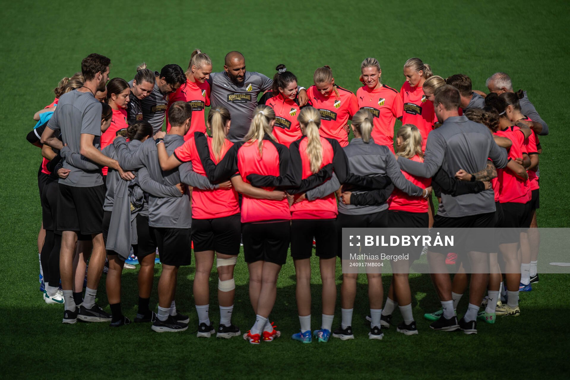 Players and staff gather