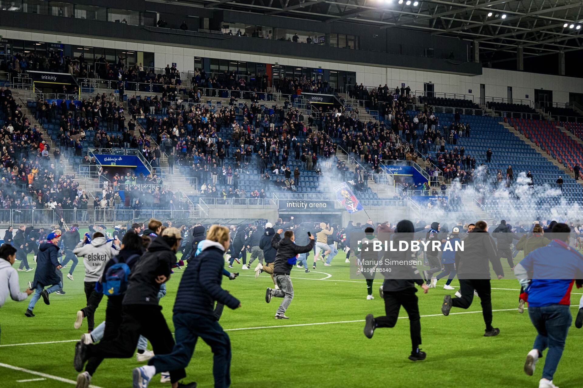 Spectators in the stands celebrates promotion to the