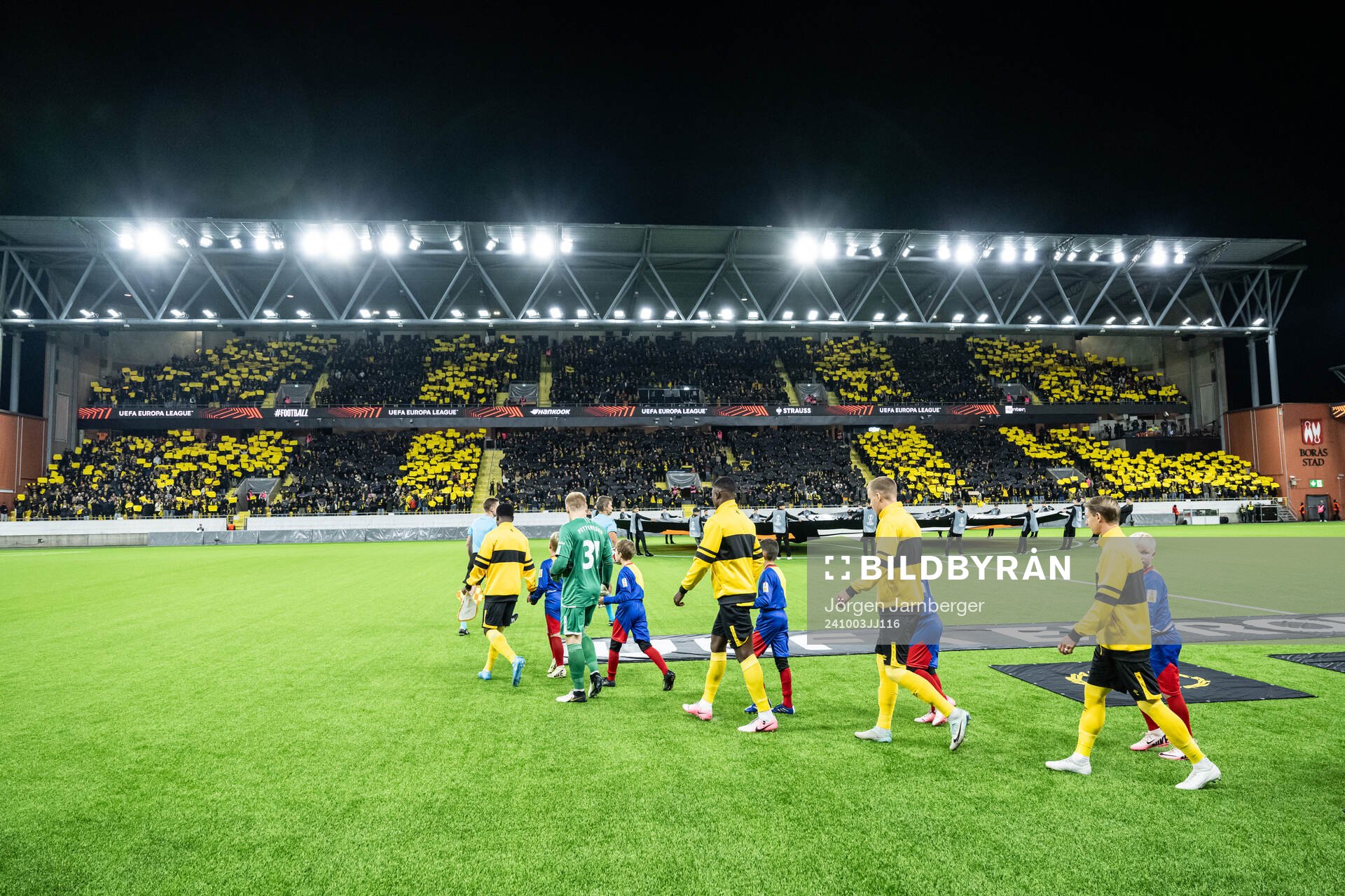 The teams enters the soccer field