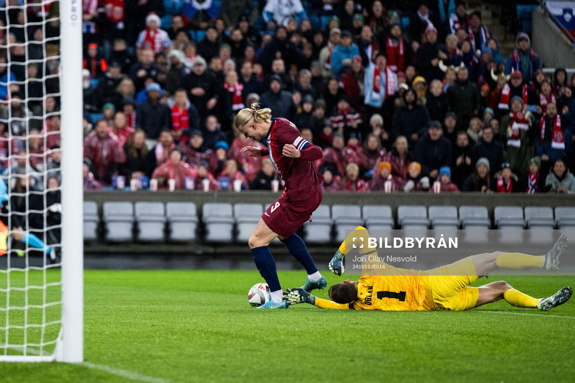 Erling Braut Haaland of Norway and goalkeeper Jan Oblak of
