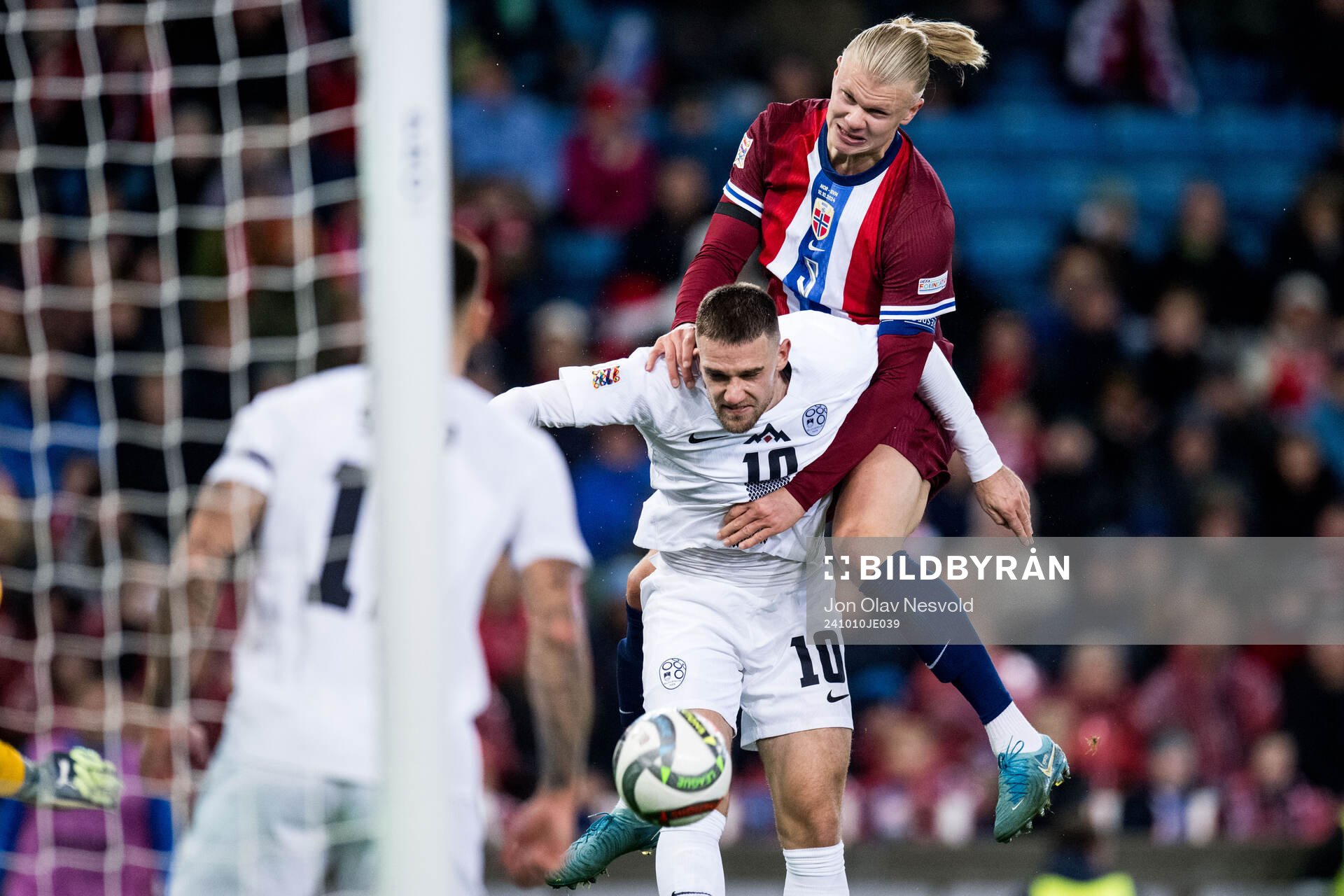 Timi Elsnik of Slovenia and Erling Braut Haaland of Norway