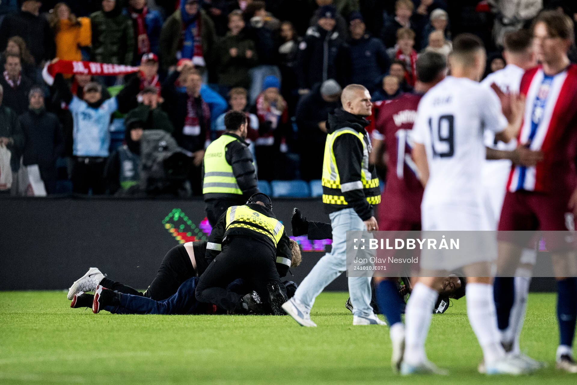 Pitch invader is taken down by security