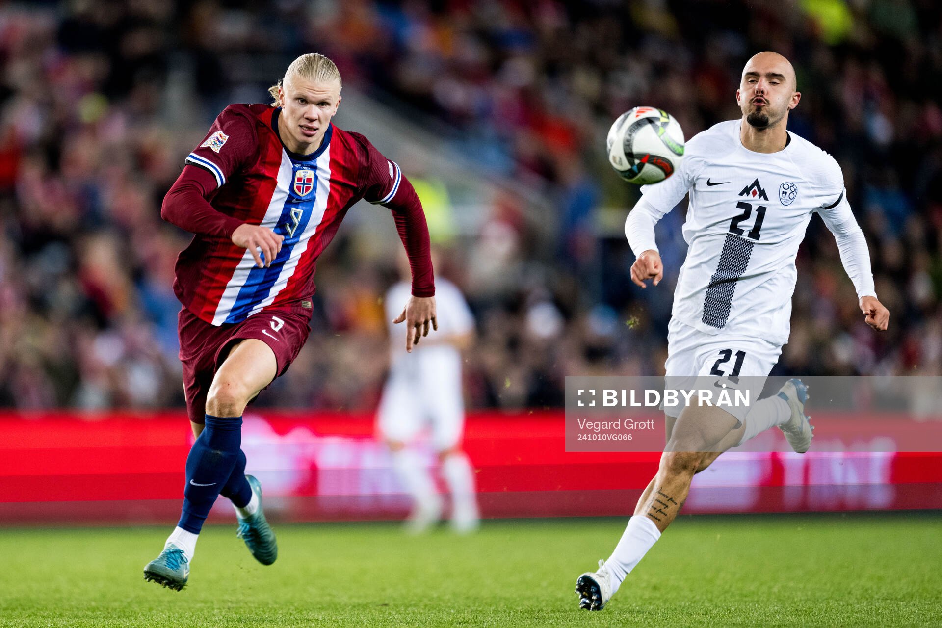 Erling Braut Haaland of Norway and Vanja Drkusic of Slovenia