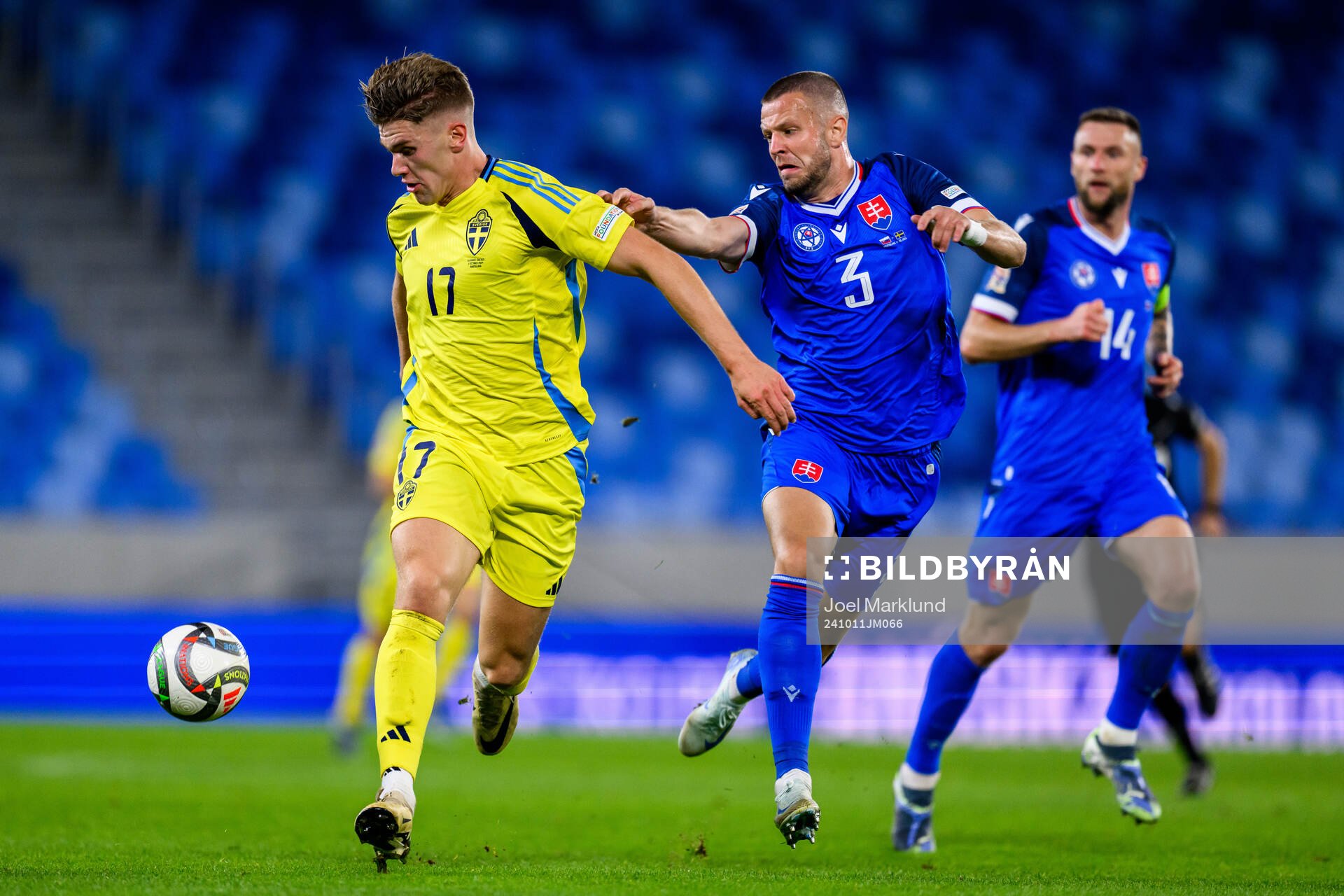Viktor Gyökeres of Sweden and Denis Vavro of Slovakia