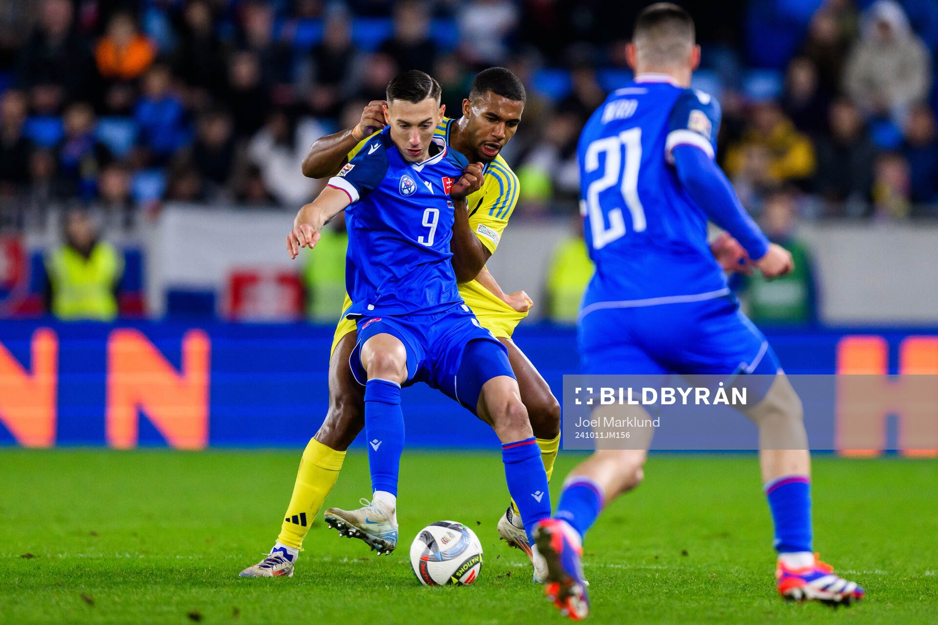 Robert Boženik of Slovakia and Isak Hien of Sweden during the Nations League football match between Slovakia and Sweden on October 11, 2024 in Bratislava.