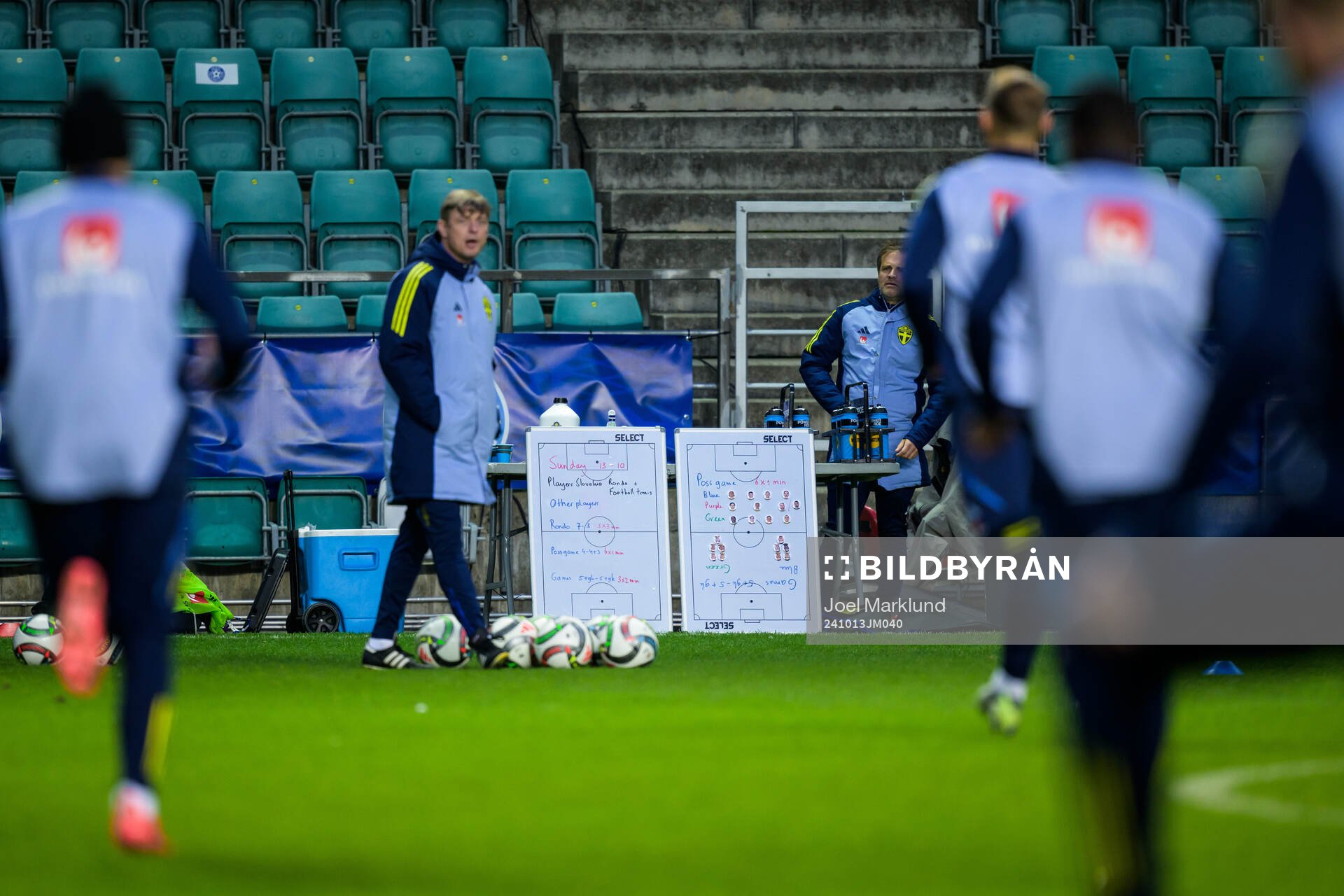 Tactical boards behind head coach Jon Dahl Tomasson of the