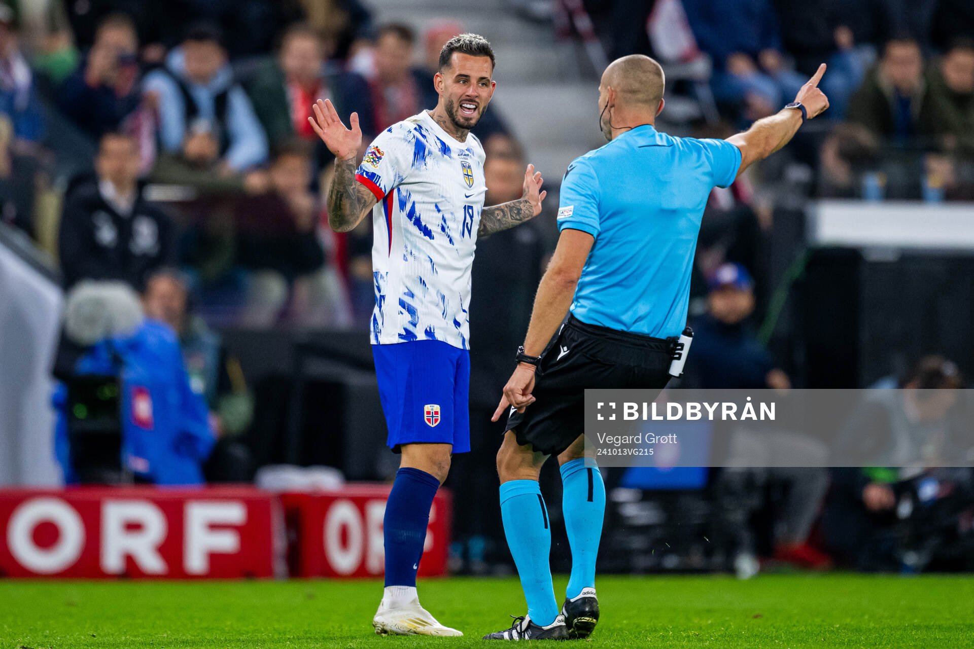 Aron Dønnum of Norway and referee Tamás Bognár