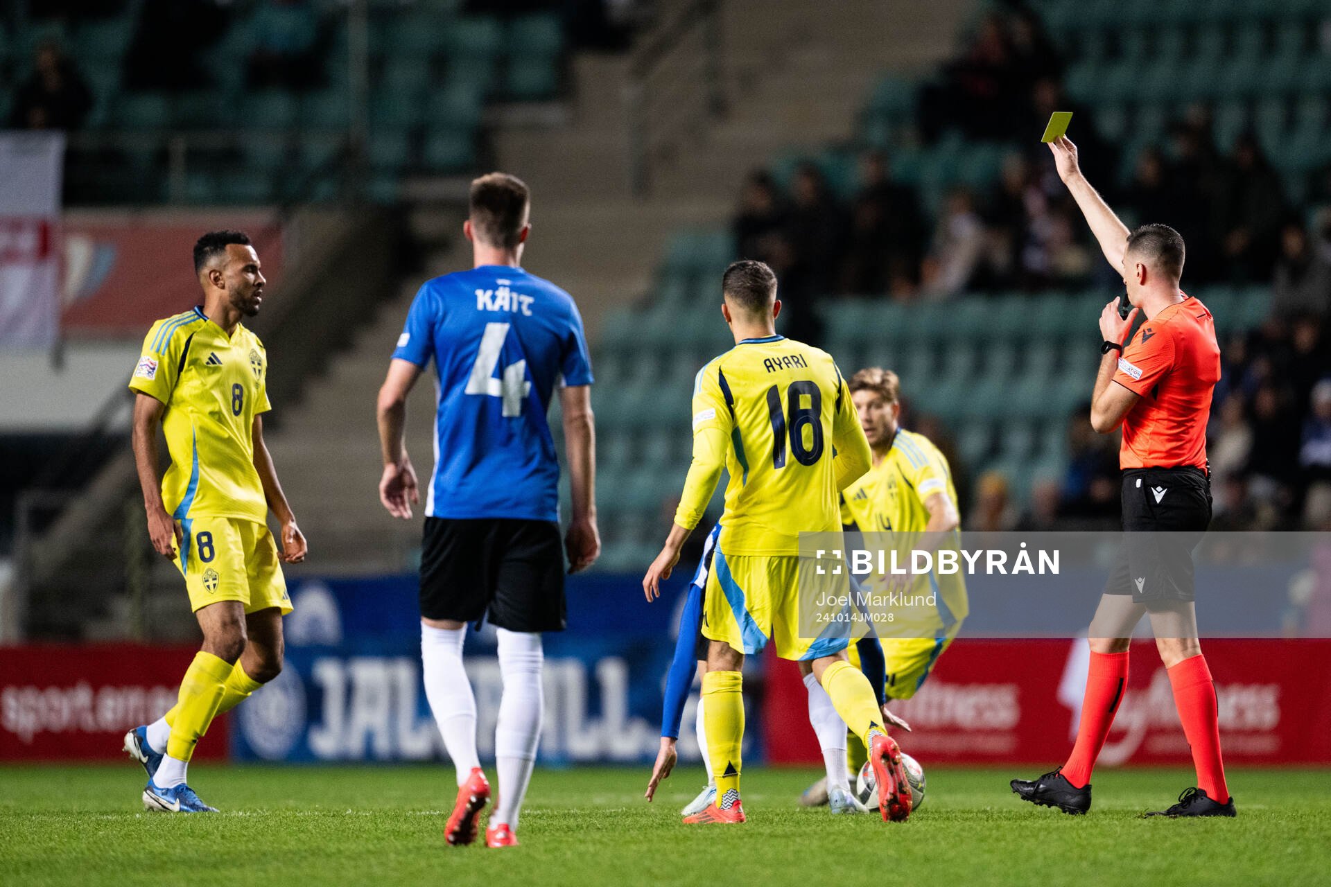 Alex Douglas of Sweden receives a yellow card from referee