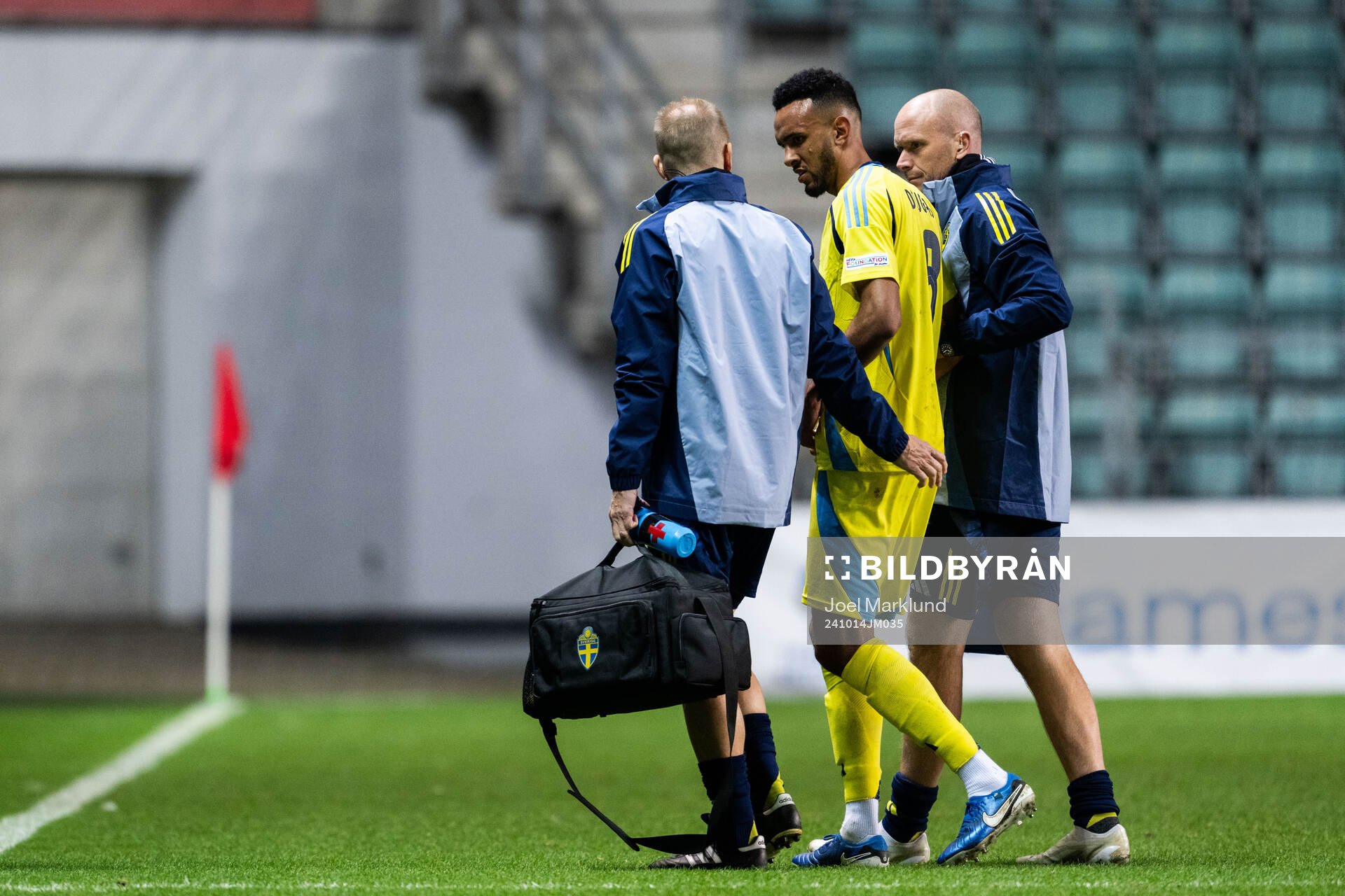 Alex Douglas of Sweden leaves the pitch injured
