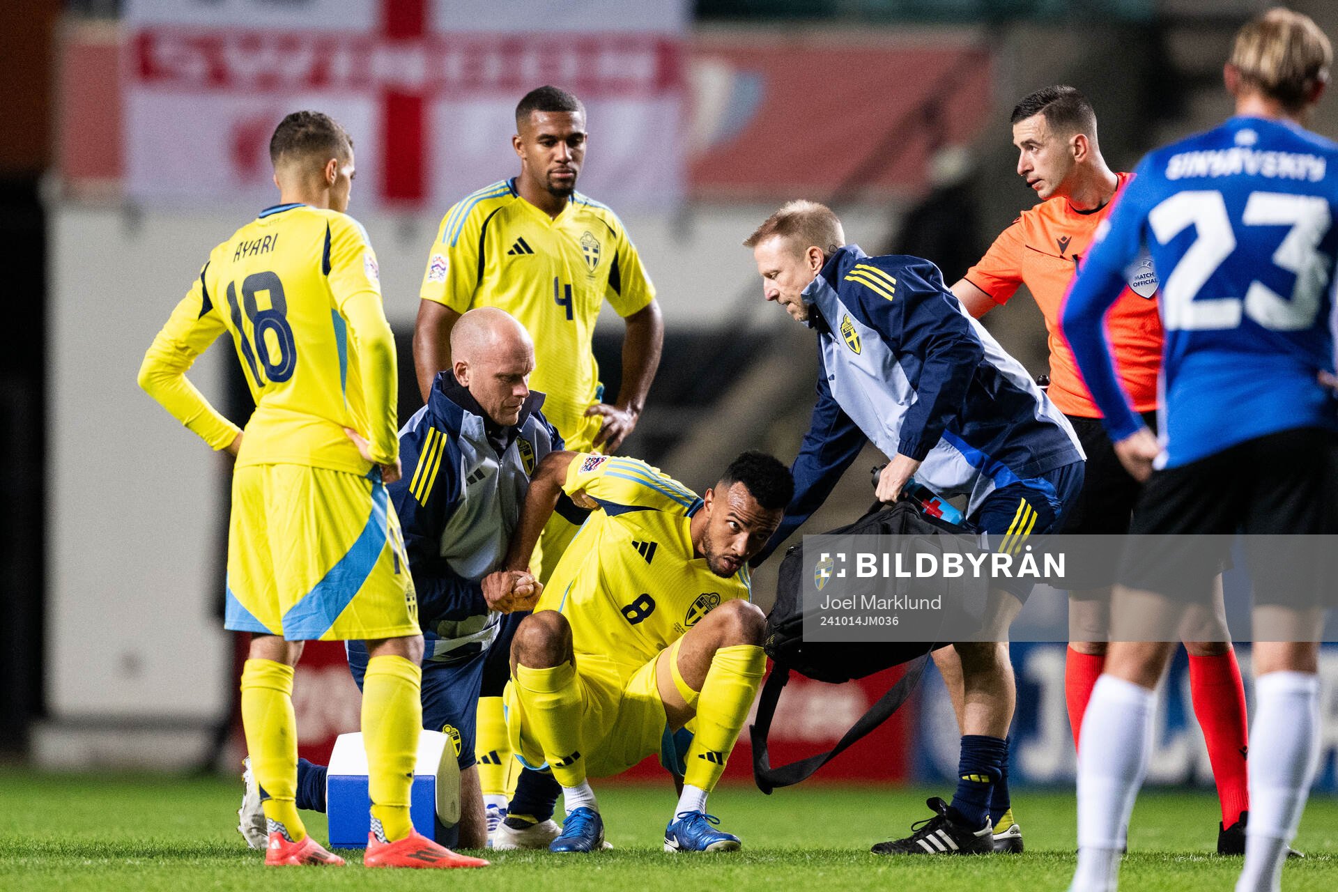 Alex Douglas of Sweden receives medical attention