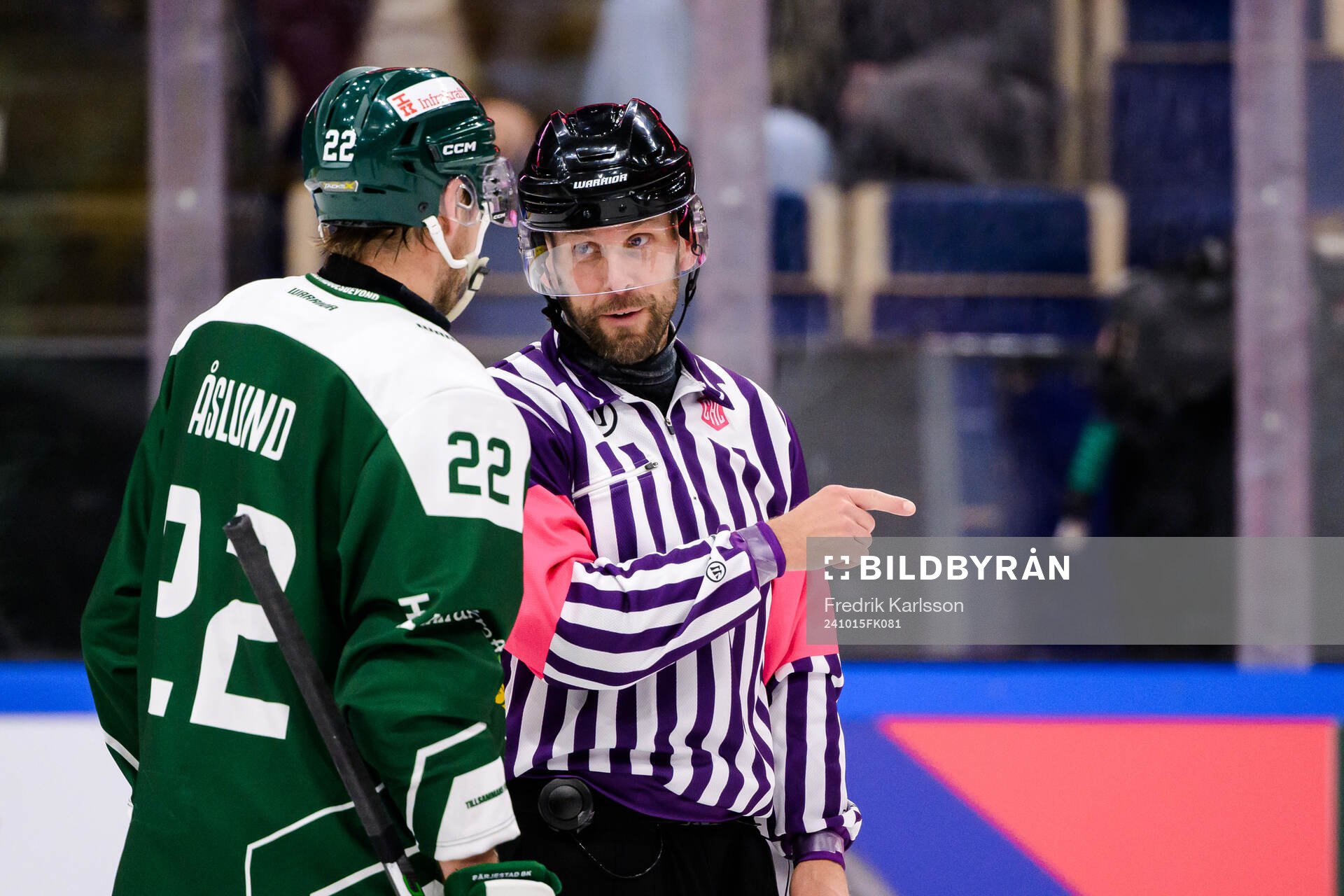 Per Åslund of Färjestad  and referee Marcus Linde